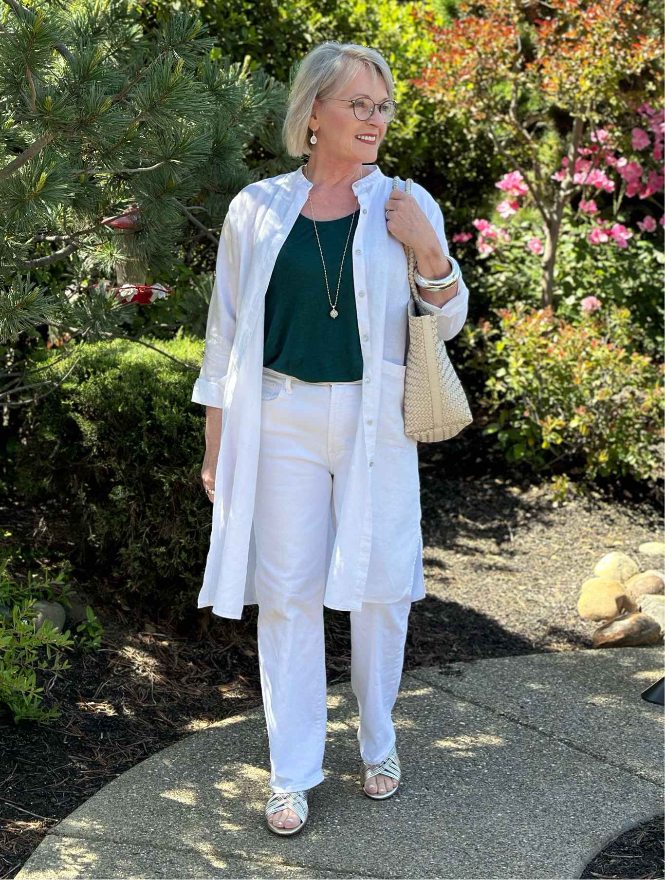 White linen shirt dress worn open
White jeans
Metallic sandals 
Woven tote bag 
Spring outfit summer outfit 

#LTKOver40 #LTKShoeCrush #LTKStyleTip