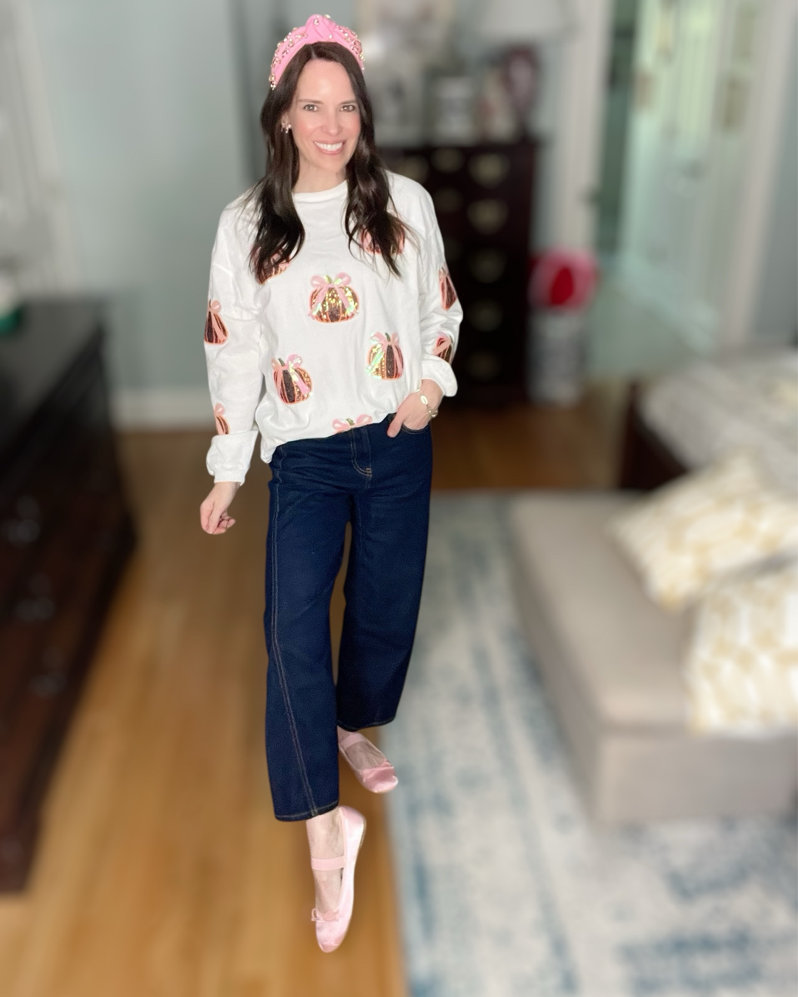 A little coquette pumpkin princess moment for Thanksgiving 🍂🎀 I couldn’t resist this adorable pumpkin sweatshirt — it has the prettiest sequins + pastel bows, so it gives festive without being the typical fall color palette. Paired it with my favorite wide-leg jeans (super comfy for all the turkey + pie moments! 🥧) and these pink ballet flats for a sweet, girly touch. The jeweled bow headband + bow earrings tie the whole coquette vibe together 🎀✨

This would be so cute for Friendsgiving, school events, pumpkin patch photos, family dinner, or hosting at home! 🍁

Sizing:
• Sweatshirt fits relaxed — wearing true size
• Jeans true to size
• Ballet flats fit TTS
• Headband + earrings are lightweight + comfy to wear all day 🎀

⸻


thanksgiving outfit ideas · cute thanksgiving outfit · casual thanksgiving look · fall outfit inspo · pumpkin sweater outfit · coquette fall aesthetic · girly fall style · sweet feminine fall outfit · wide leg jeans fall outfit · ballet flat trend · coquette bow accessories · hostess outfit ideas · family dinner outfit · friendsgiving look 🎀🍂

#LTKHoliday #LTKFindsUnder100 #LTKFindsUnder50