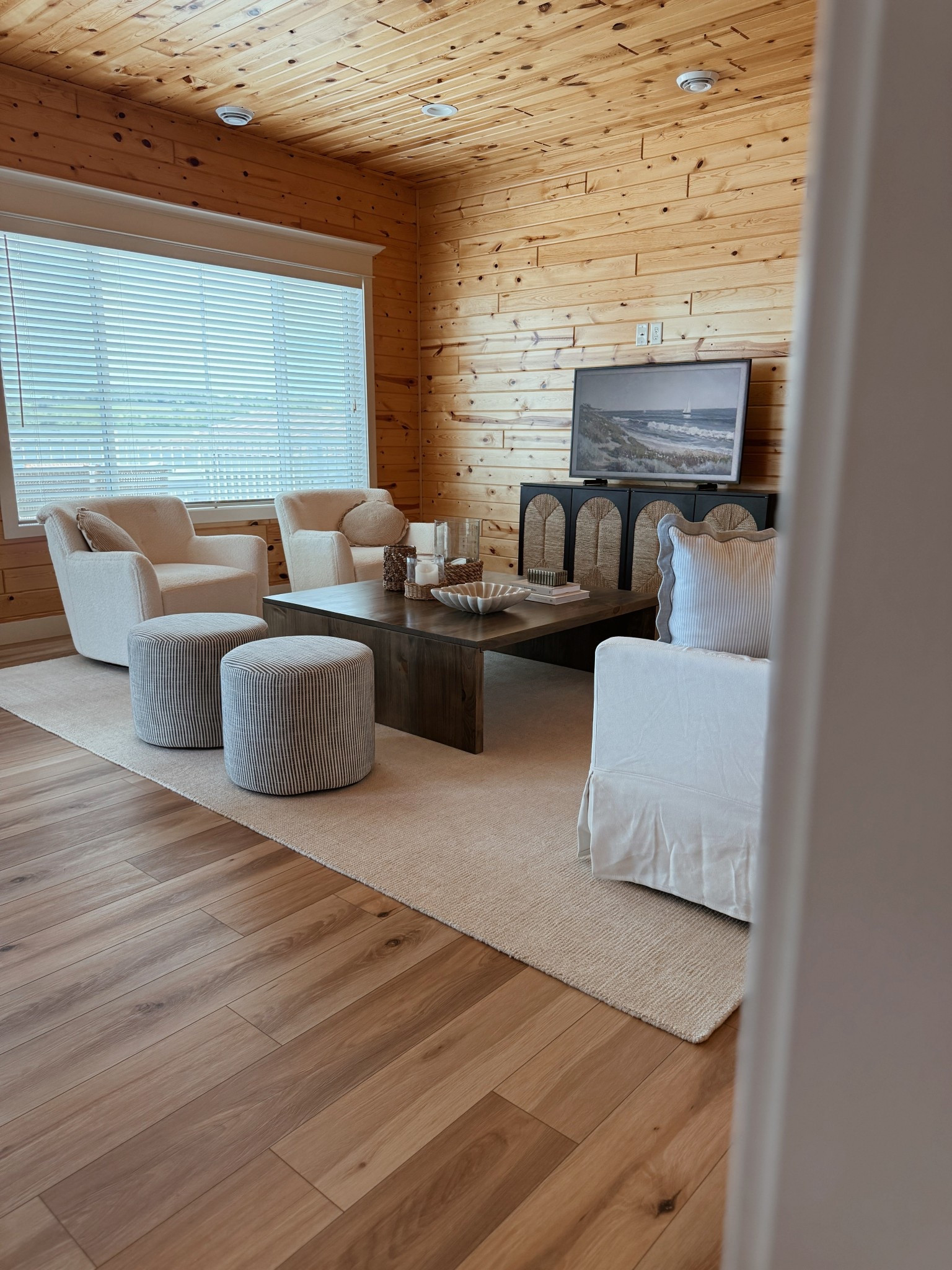 Shop our lake cabin living room! Our coffee table is on sale and at a great price (we have the 48x48” size) for solid wood. Love this neutral rug and ottomans!

#LTKHome #LTKStyleTip #LTKSaleAlert