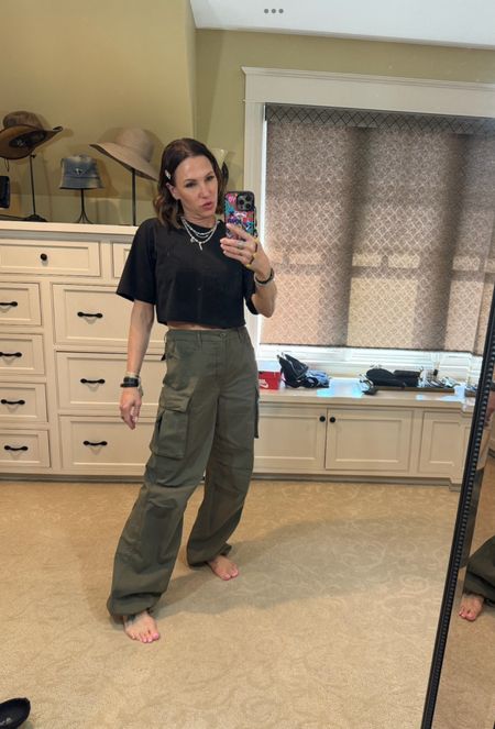 Obsessed with these army green cargos and this shiny detailed black crop top! Wearing size small in shirt and size 25 in pants. 

#LTKover40 #LTKstyletip #LTKfitness
