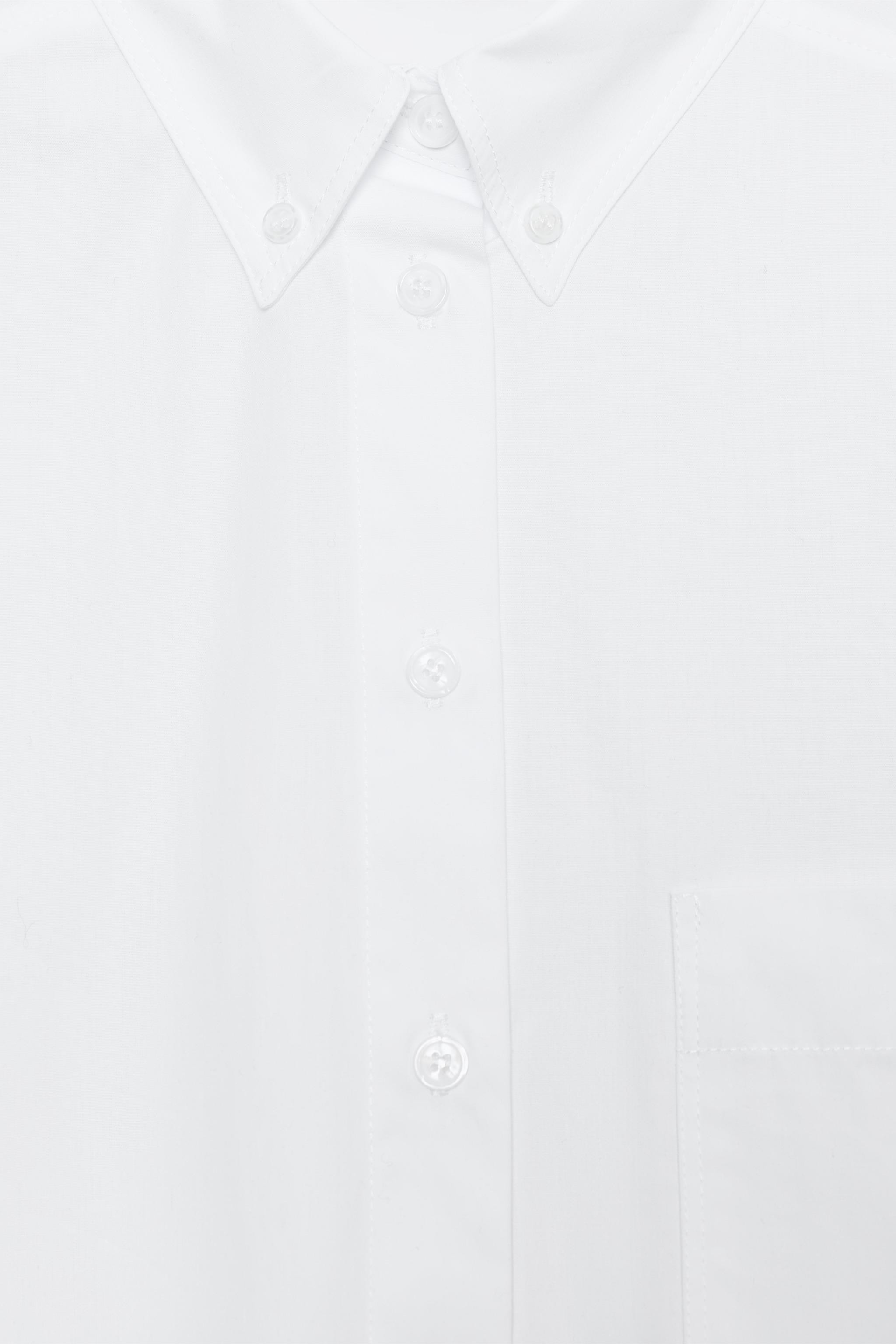 Shirt with main fabric made of 100% cotton yarn. Lapel collar and V-neckline. Long sleeves with c... | Zara US