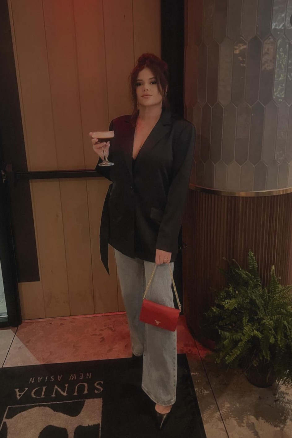 Black satin blazer , wide leg blue jeans , red wallet on chain / pumps 

#LTKShoeCrush #LTKSeasonal #LTKMidsize