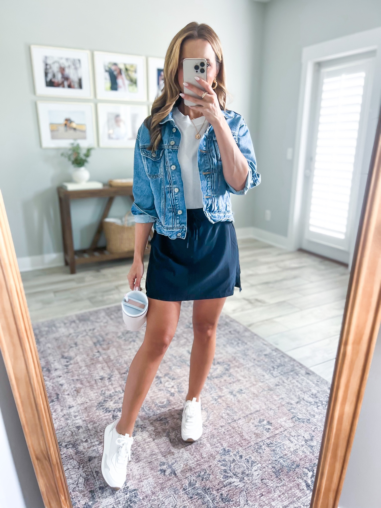 Target activewear skort (XS). Target white t-shirt (XXS). Old Navy denim jacket (XSP). Target white sneakers (TTS). Disney outfit. Theme park outfit. Mom outfit. Casual outfit. Baseball mom. Mom style. Rose quartz stanley.