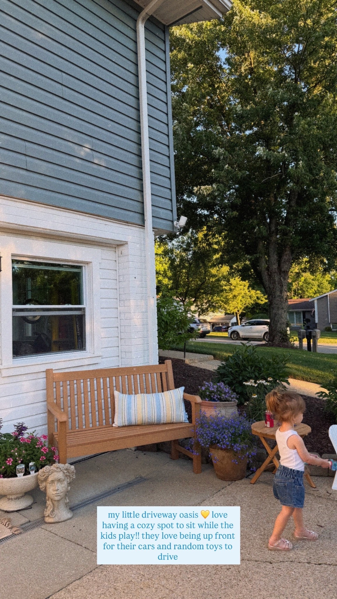 my little driveway oasis 💛 love having a cozy spot to sit while the kids play!! they love being up front for their cars and random toys to drive
