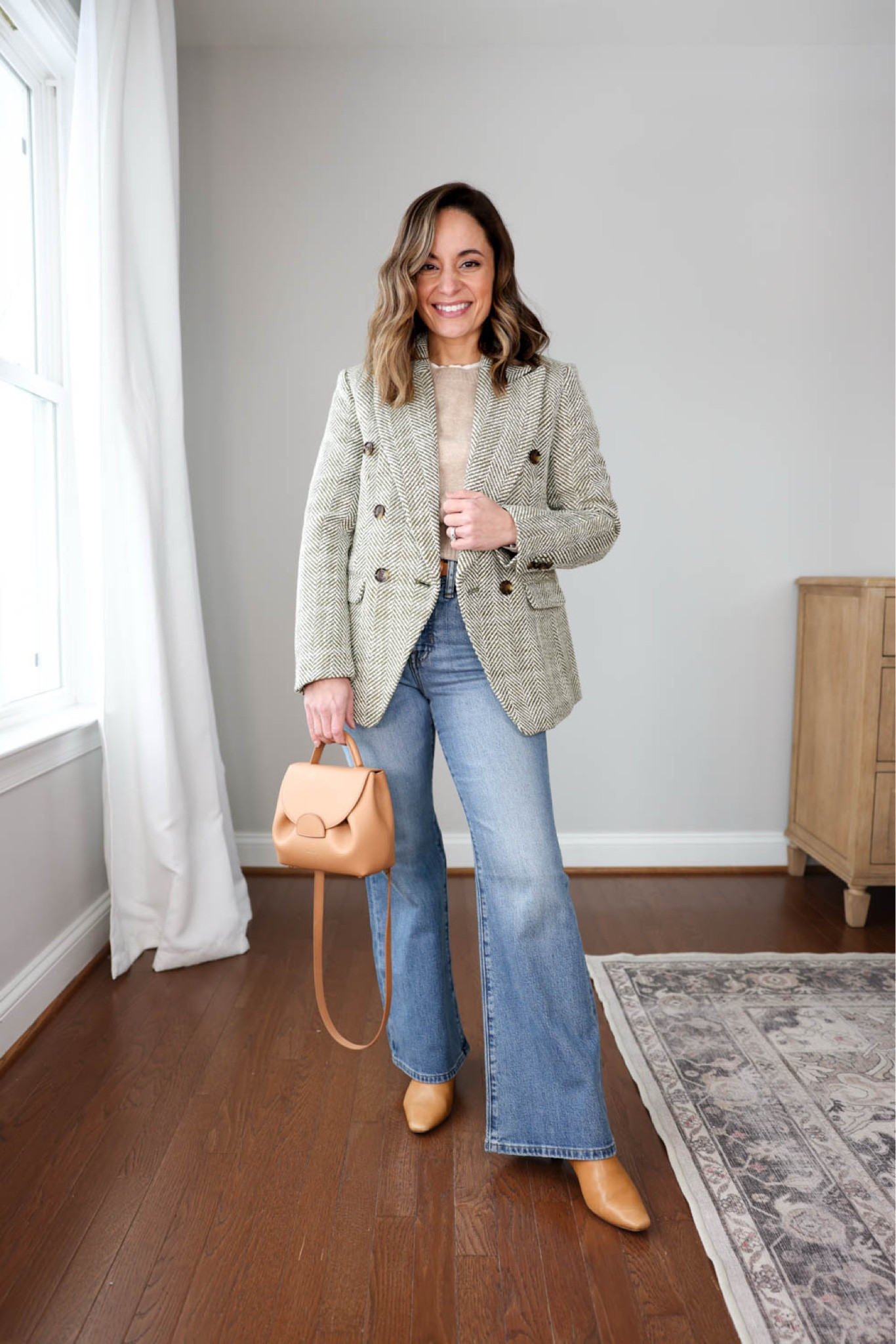 Petite-friendly flare jeans outfit! 

Jeans (J.Crew): petite 23 size down 
Sweater (J.Crew): xxs 
Blazer (BR Factory): petite 00 
Bag: Polene - unable to link 
Boots are linked for reference but they’re sold out in the exact color I’m wearing 

My measurements for reference: 4’10” 105lbs bust, waist, hips 32”, 24”, 35” size 5 shoe. 25” inseam measurement to my ankle bone. 