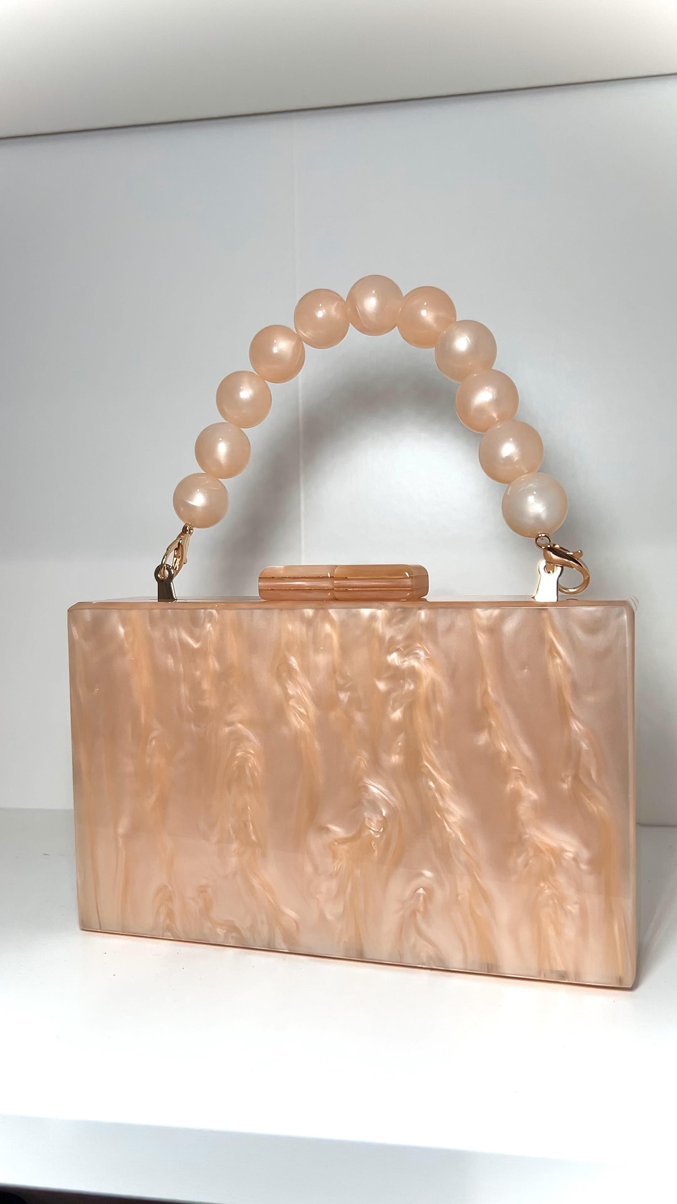 The cutest acrylic marble clutch purse for only $9.99!!!?! Available in other colors too for various prices! Can wear for a wedding, vacation, etc! 

#LTKitbag #LTKSpringSale #LTKsalealert