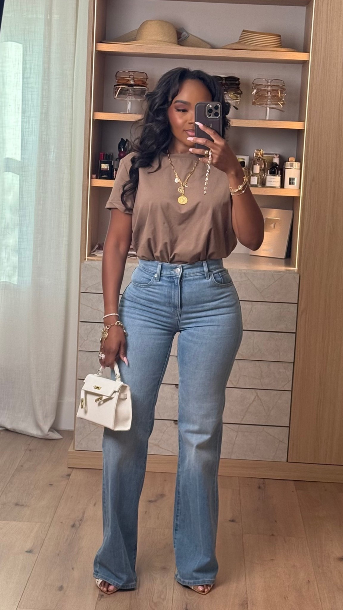 Hi babes! 🤎

Okay this neutral tee + perfect denim combo is EXACTLY the kind of outfit that always performs because it’s effortless, flattering, and insanely wearable. The warm mocha tone paired with this dark wash flare denim gives that elevated everyday vibe without trying too hard.

A good fitted tee and great jeans will forever be one of the smartest wardrobe investments because you can style them a million different ways. Added layered gold jewelry + a structured mini bag to give it that luxury-inspired feel while still keeping the look casual and easy.

Where to wear this:
• Coffee runs
• Casual office days
• Lunch dates
• Everyday errands
• Weekend shopping
• Casual dinner nights

This is one of those outfits where the cost per wear drops FAST because every piece works with so many staples already in your closet. Simple outfits styled well always look the most expensive.

Everything is linked below ✨

xx Kira | IG: KirasFashionFinds

5’4 | 140LBS | 34D-27-40 | size small | jeans 27

#LTKgrwm #LTKvlog #LTKU