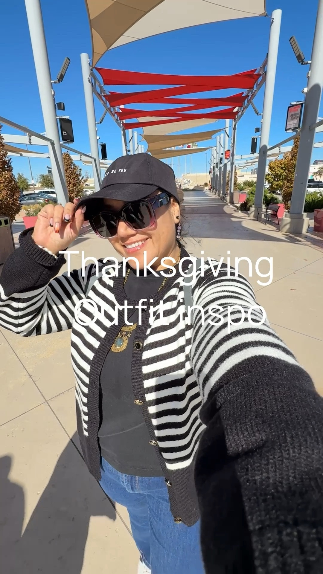 Comfort and polished Thanksgiving outfit to take family photos in the living room and of course to go out after dinner!
Long sleeve black knit, striped cardigan, flared dark denim jeans with trainers.

The hat has an opening for hair styled up and sunglasses since the sun is still out in Texas during November. We always wear sunscreen and lip gloss!

#LTKPetite #LTKSeasonal #LTKHoliday