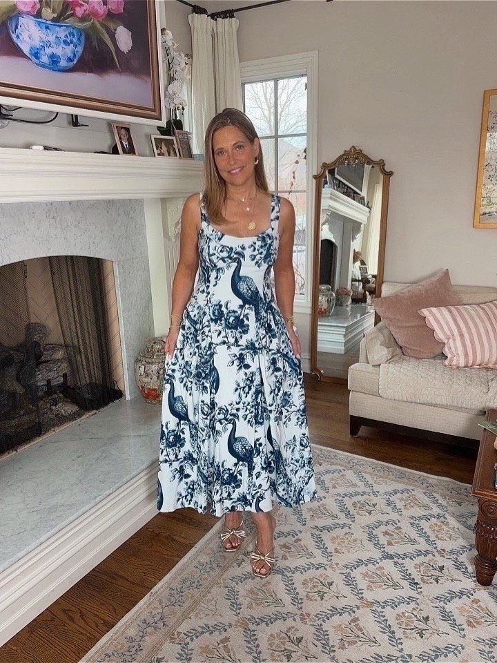 We love how easy this dress is to wear. The peacock print in blue tones feels classic but still fresh, and it works just as well with sandals as it does with heels. Wearing a size 8 in this dress! s