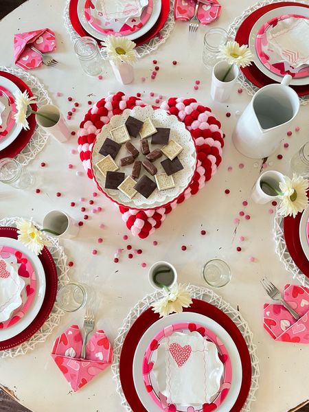 Set a beautiful Valentine’ Day tablescape with white dinner plates, red chargers, Pom
Pom wreath and white cups #valentinetable #valentinesday #tablescape

#LTKSeasonal #LTKhome