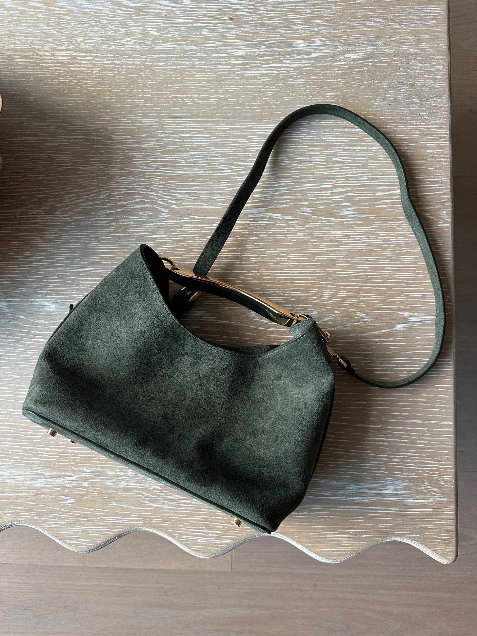 New bag in my collection: the Small Boomerang by Elleme. This stunning suede bag features heavy gold hardware a crossbody strap and metal feet too! I love how elegant it is and the khaki green Color is stunning 🤩  

#LTKgiftguide #LTKcanada #LTKbag