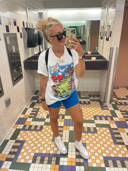 Hollywood studios outfit. Biker shorts, graphic tee , converse. Water bottle, amazon sunglasses, baggalini bag. Toy Story shirt 

#LTKFind #LTKstyletip #LTKtravel