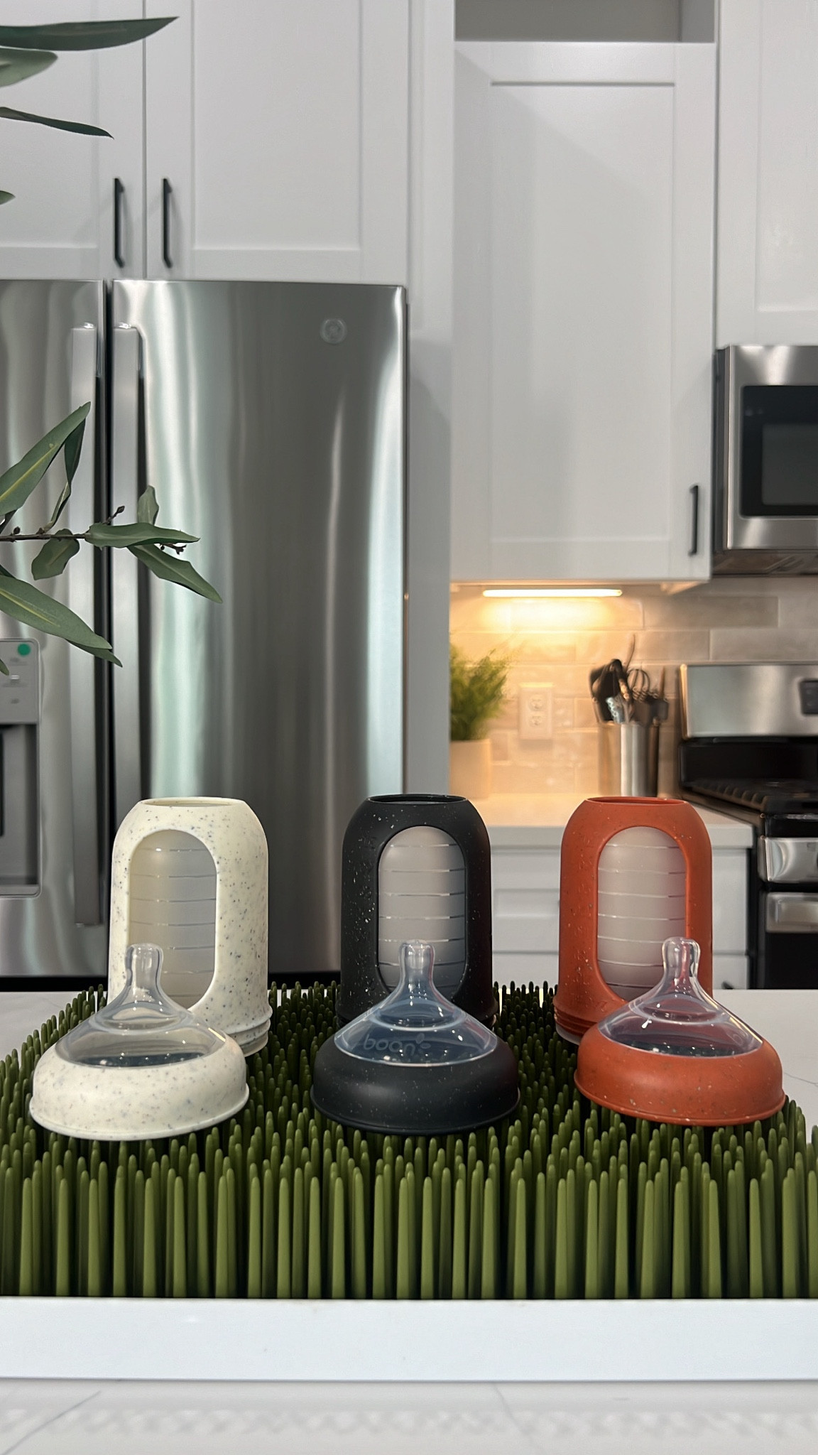 Our new favorite bottles & drying rack from Boon. Love how they match the aesthetic of our house and the bottles can grow with the baby! 

#LTKbaby #LTKfamily #LTKhome