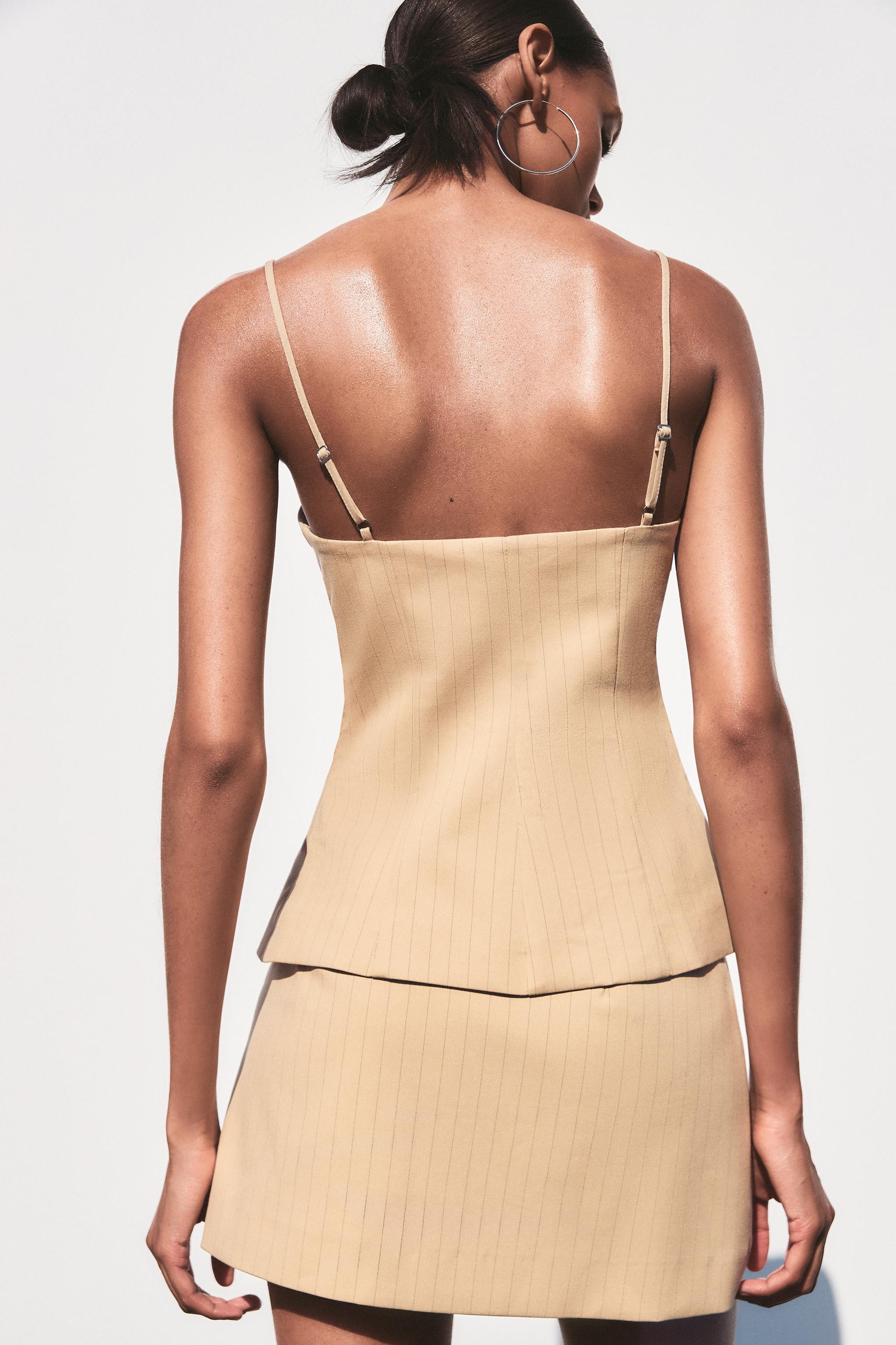 Straight-neck top with keyhole opening. Adjustable spaghetti straps. Matching lining. Front slit ... | Zara US