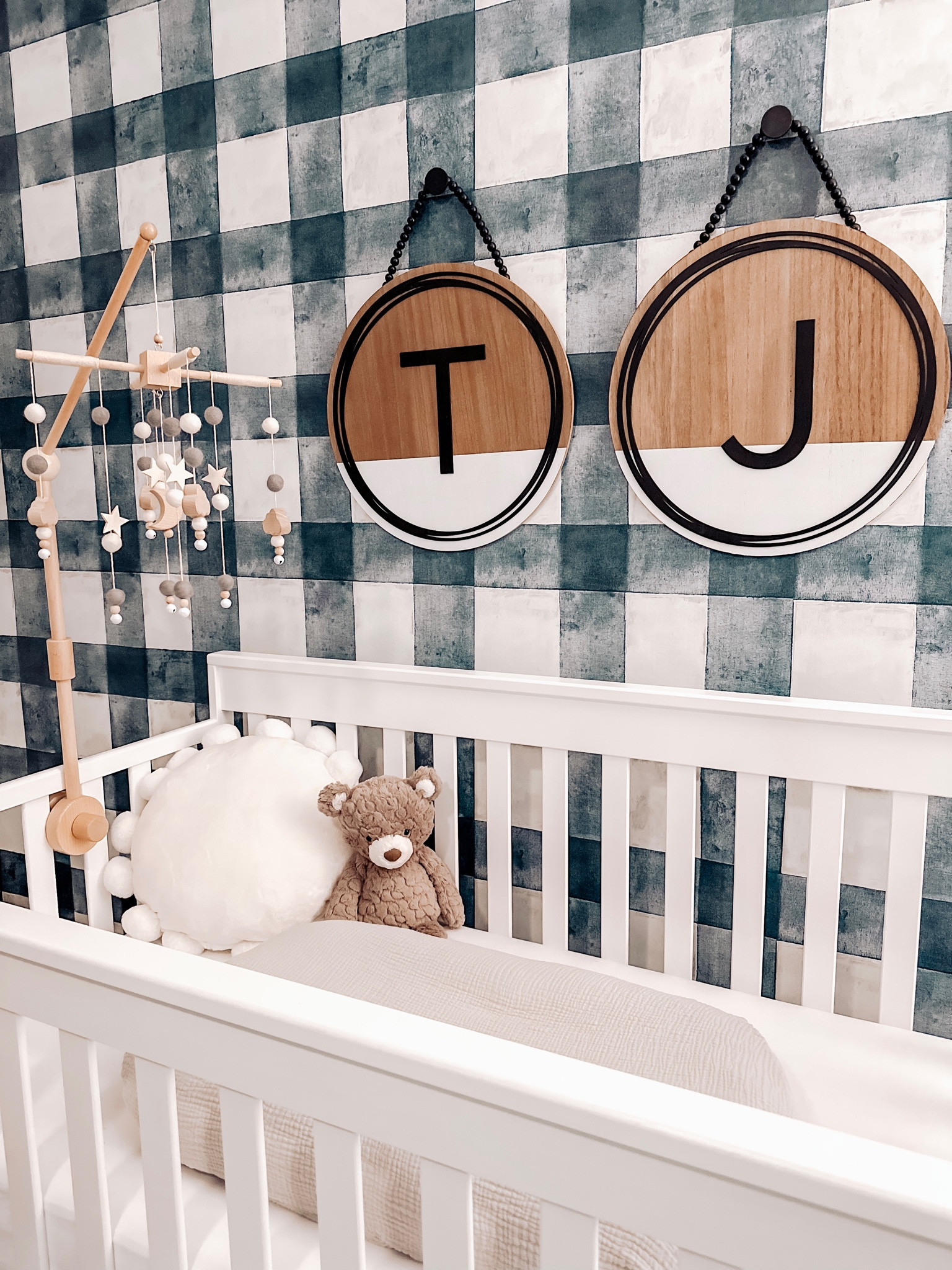 Crib accents and decor for nursery! Monogram initial wood signs, wood baby mobile, teddy bear, snuggle me baby lounger, simple white crib, navy blue Buffalo plaid wallpaper roommates.

Boy nursery baby boy neutral 

#LTKhome #LTKbump #LTKbaby