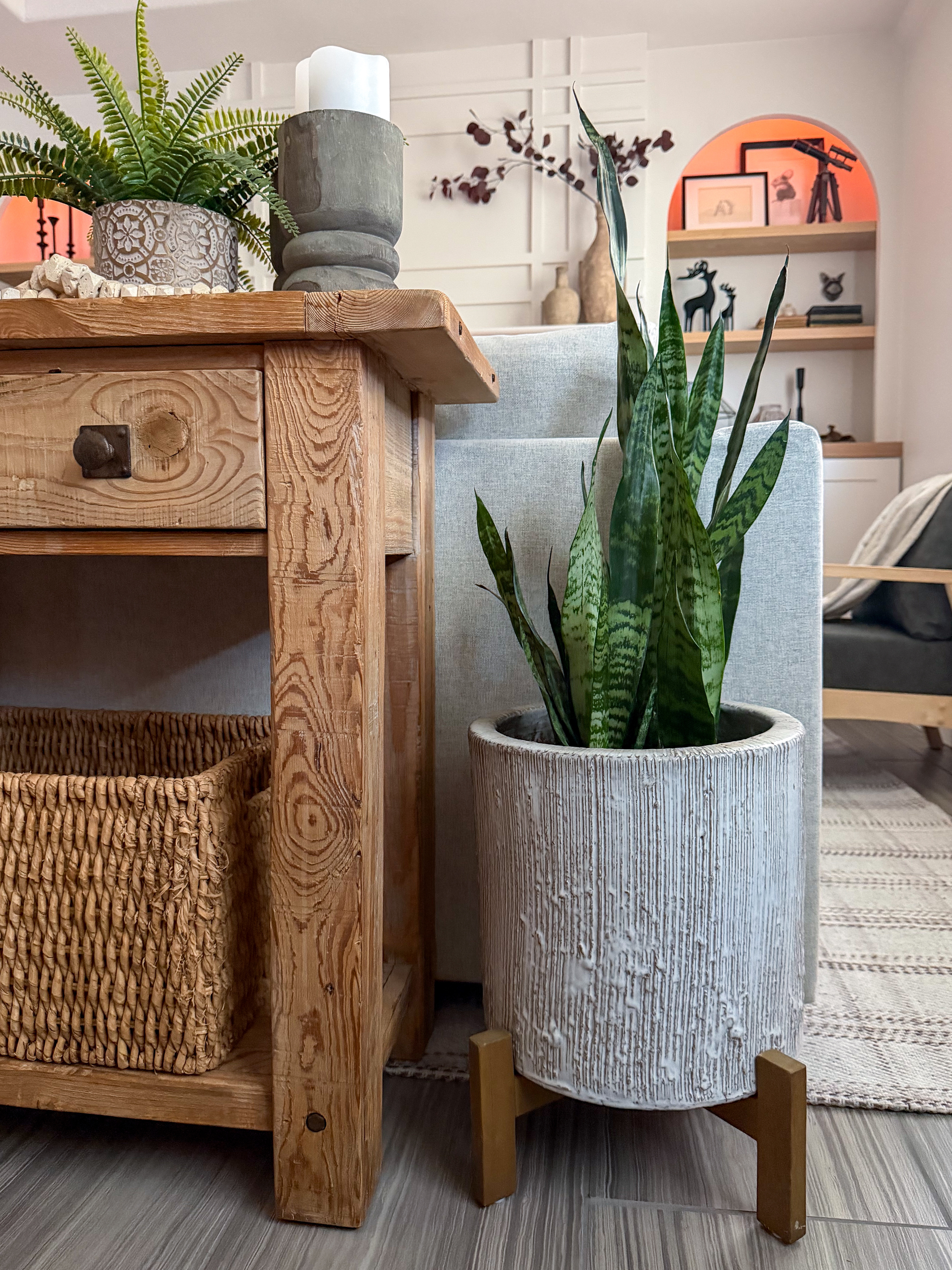 One of my favorite things about this photo is how your eye moves through the room. You're first drawn to the planter and console, but then you start noticing all the layers—the plants that bring life to the space, the wood tones that add warmth, and the thoughtfully styled accessories that make the house feel personal.

#LTKHome