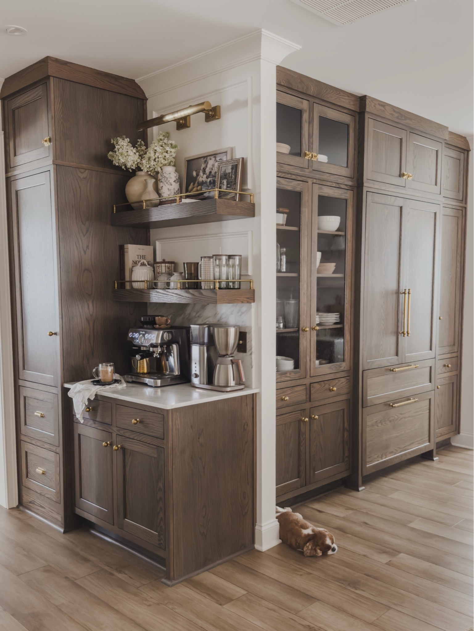 Collected style coffee bar with both functional and aesthetic finds for every day use! This area is used multiple times a day and love having all of my items displayed in a timeless style.

Home finds, neutral home inspo, coffee bar details, timeless kitchen inspo, collected style, rich wood tones, brass details, marble countertop, espresso machine, floating shelves, brass gallery railing, coffee mug, digital art, picture light, Rejuvenation, Etsy, Breville, found it on Amazon, Pottery Barn style, Wayfair, shop the look!

#LTKSeasonal #LTKHome