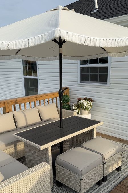 ✨ The perfect addition to my Walmart Patio set… this gorgeous tasseled umbrella! #walmartpartner #walmarthome @Walmart 

I saw this umbrella when I was browsing the app the other day and immediately knew it would be perfect for my space that gets sun all day long - I love to sit in the shade and this umbrella is going to be perfect for spending even more time outside this summer! 

Included in my current patio lineup is the Brookbury Patio Set that includes the L couch, coffee table, and two side stools that tuck under the table, as well as this gorgeous border rug, an ember urn planter, a faux triple topiary, all from Walmart!  I’ve linked a few of my other favorite patio sets and patio accessories from Walmart in my LTK - make sure you look and see what other great finds Walmart has (P.S. - so many pieces are on deal for MDW!)

