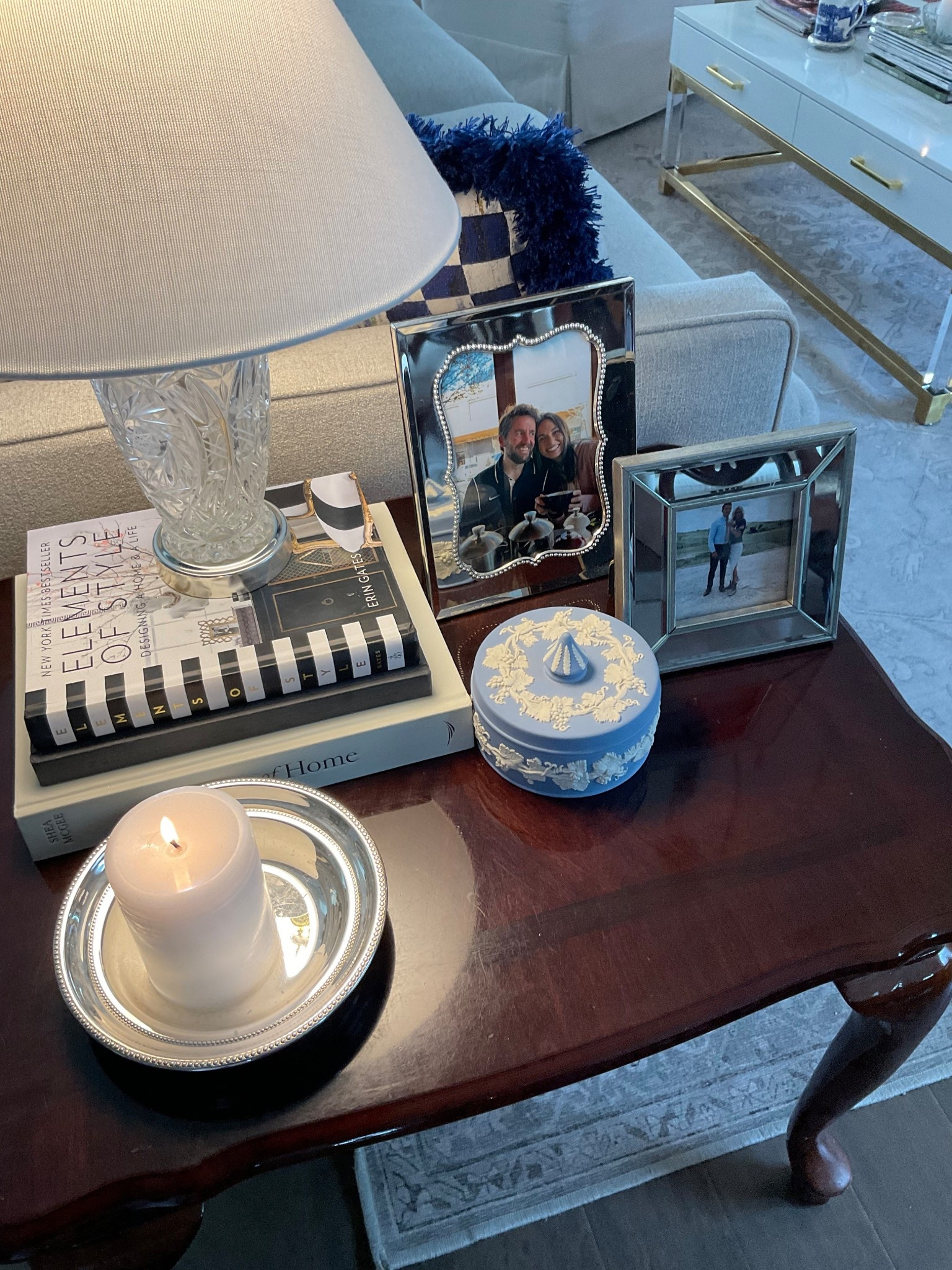 Dark wood side accent table styled with silver picture frames, a crystal lamp, and a collected stack of books for that layered, lived-in look 🤍 The rich stain adds warmth and depth while the reflective finishes keep it light and elegant. Finished with classic blue-and-white touches inspired by Wedgwood jasperware for a timeless Southern aesthetic that never goes out of style.
Perfect for a living room corner, bedside table, or cozy reading nook.
#LTKHome #SouthernStyle #TraditionalHome #TimelessDecor #ClassicInteriors #CollectedHome #DarkWoodFurniture #BlueAndWhiteDecor

#LTKU #LTKhome #LTKstyletip