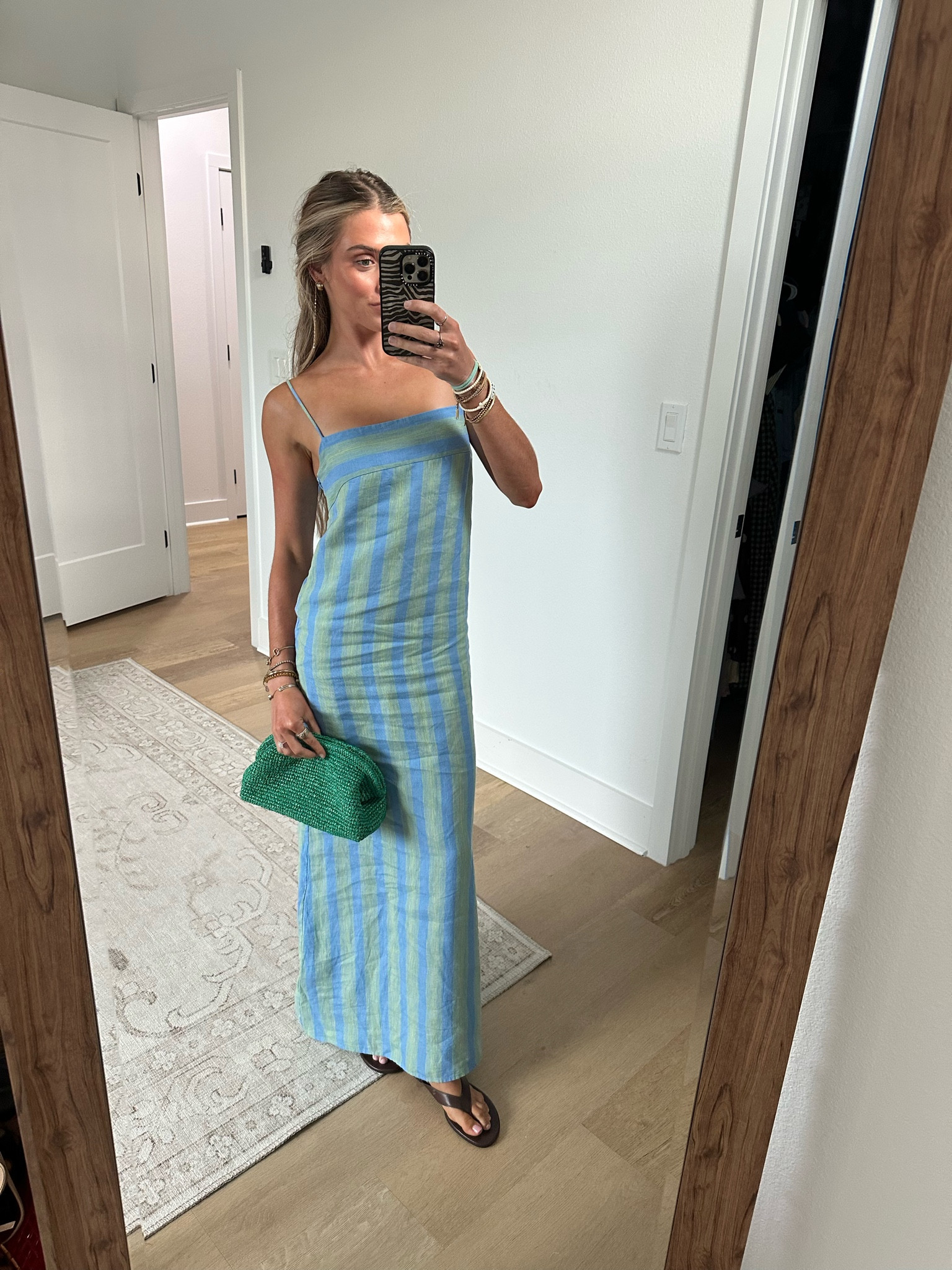 My dress is from @staud it’s the Laura striped linen maxi dress size xs. I got mine from @renttherunway  my code is RTRXSVOSEN50. I paired it with my @jcrew  accessories my leather flip flop sandals and my green raffia handbag.

#LTKdayinmylife #LTKootd #LTKSaleAlert