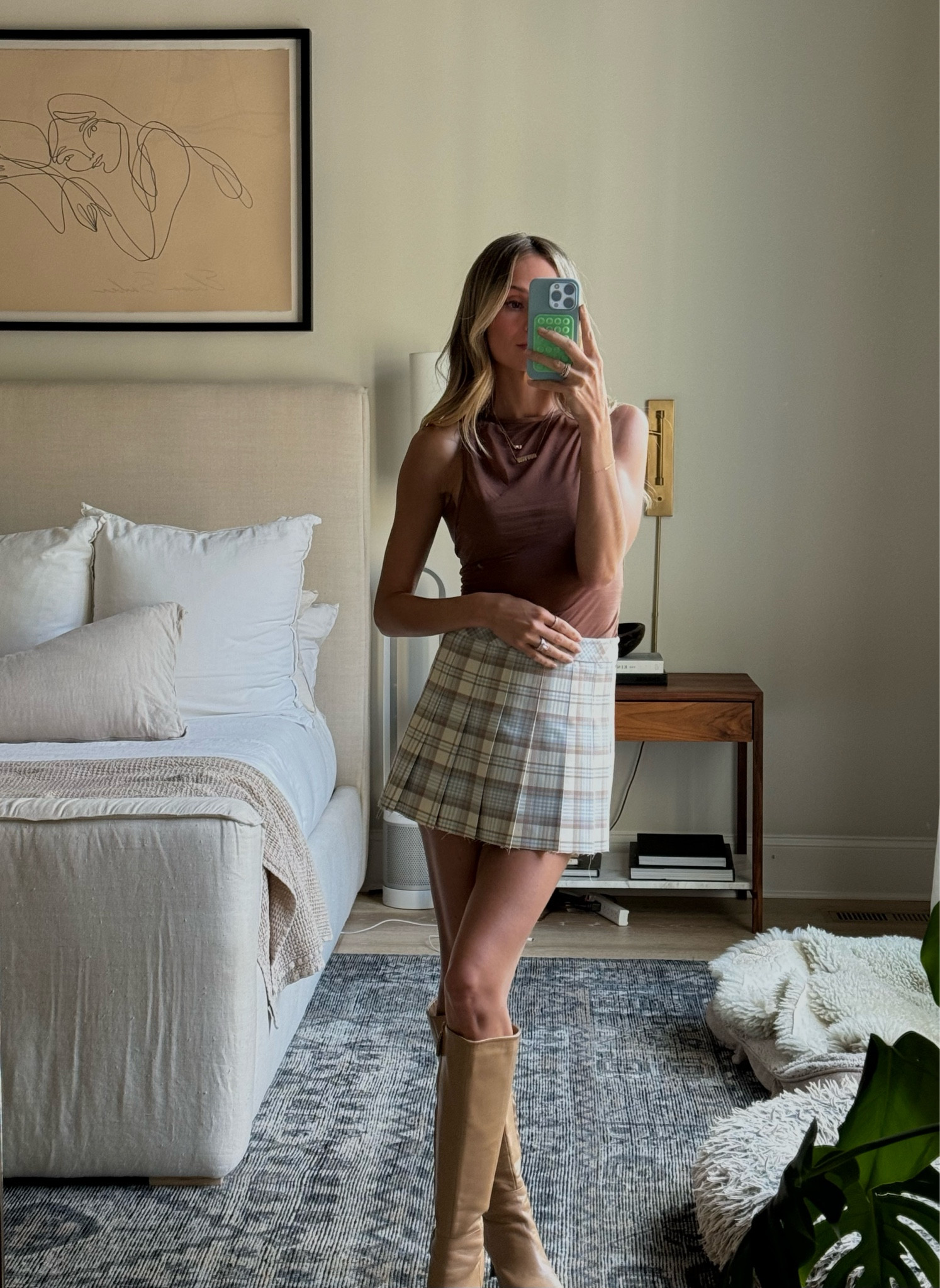 Date night outfit 🤎 skirt is sold out in this color but linking the same skirt in green! I cut it a little shorter with fabric scissors and I like the raw hem! Boots are only available in black so linking another similar pair!