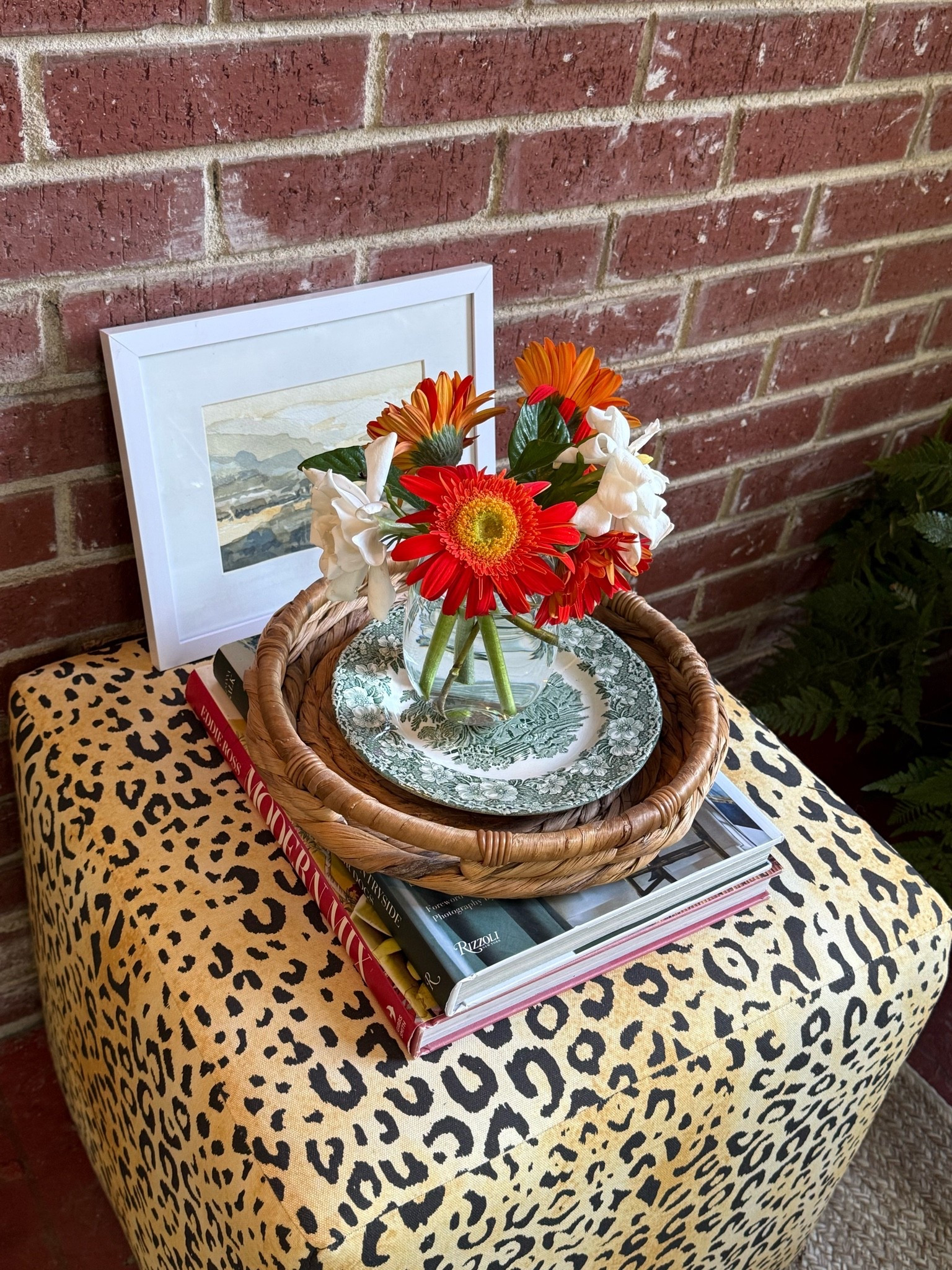 this leopard cube is perfect to prop your feet up, as a seat or as a table. tray is jenni kanye via poshmark. plate is wedgewood from my parents. my husband is a talented painter! I love a stemless wine glass as a vase for petite bouquets! books linked below plus options for this entire look. .

#LTKdayinmylife #LTKHome #LTKSaleAlert