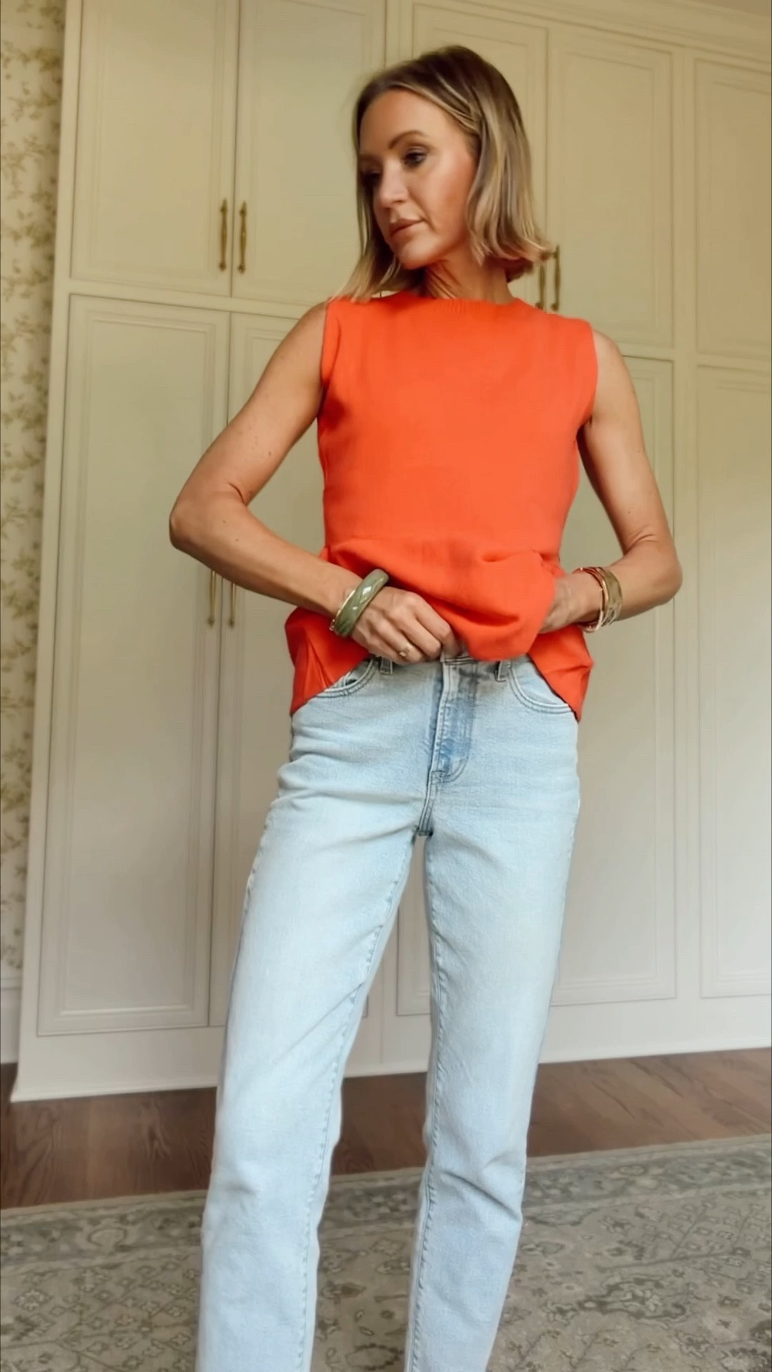 Small in top 
Size UP in the jeans. Wearing the 4