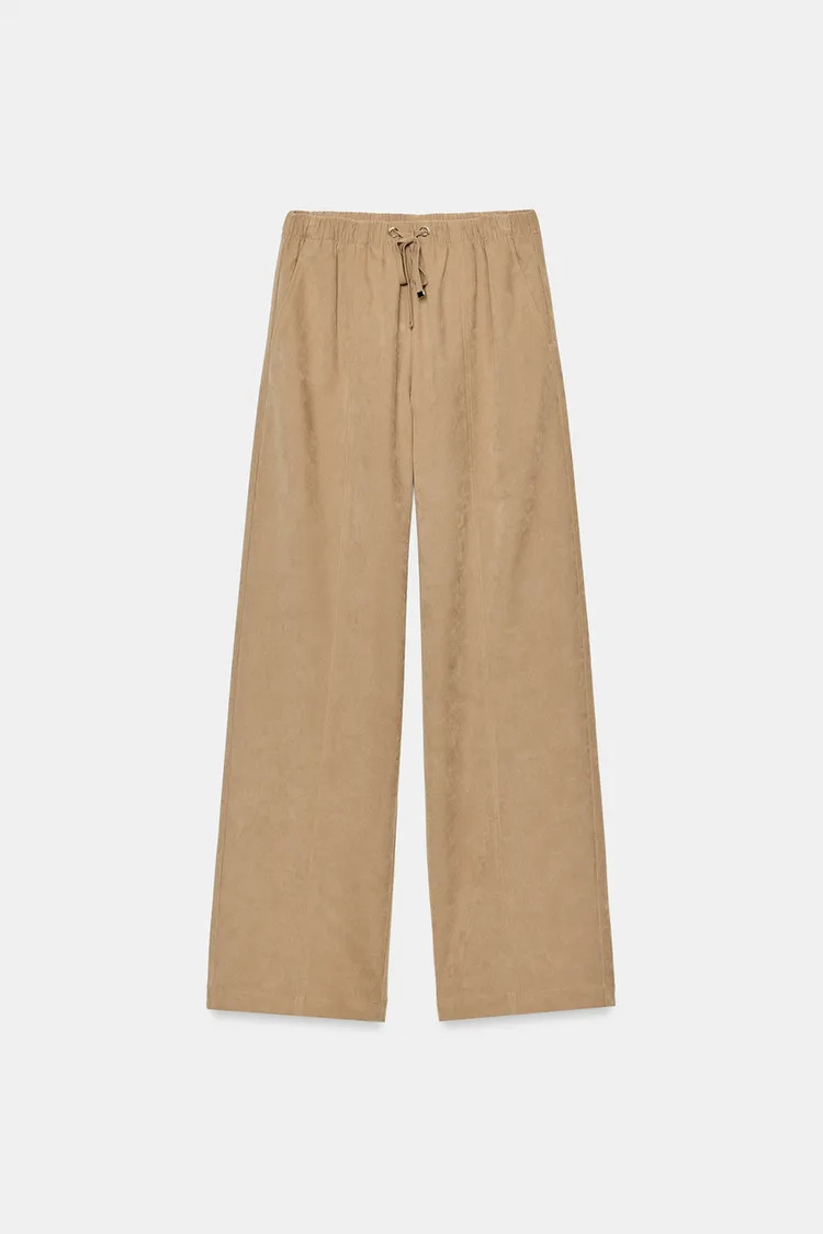 High-waist trousers with an adjustable elastic drawstring waistband. Featuring front pockets, fal... | Zara UK