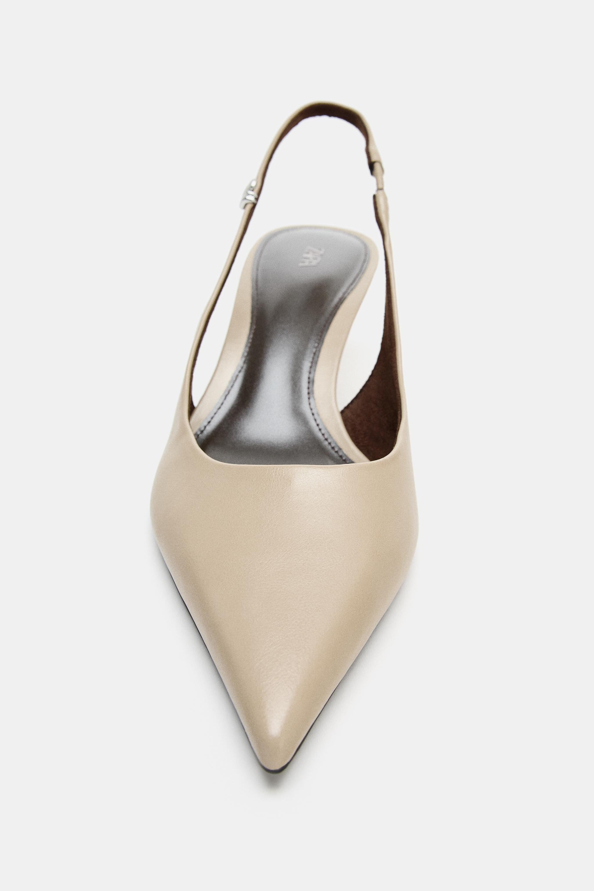 Slingback shoes with kitten heels. Pointed toe. Back strap with elastic on the side. Metallic det... | Zara US