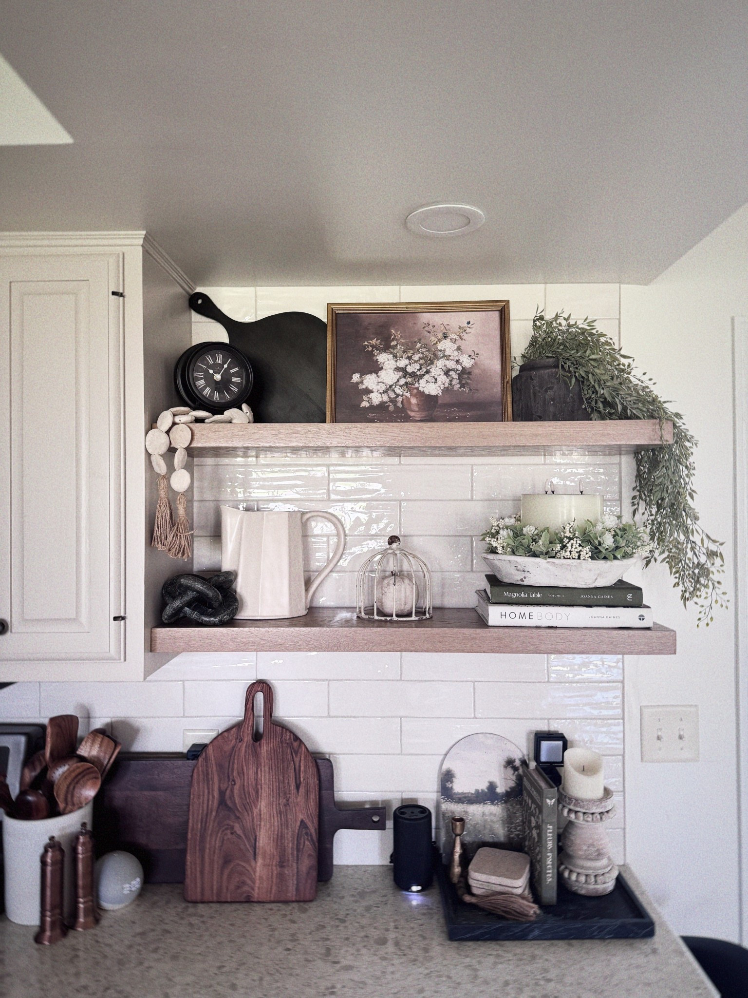 Neutral shelfie vibes 🤍 Mixing wood tones, white ceramics, and faux greenery for a fresh transitional look. Tap to shop similar finds: pitchers, books, cutting boards, and more from my LTK!


neutral decor, kitchen styling, open shelves, Amazon finds, farmhouse modern, kitchen shelf decor, faux greenery, LTK home, shelfie inspo, transitional home