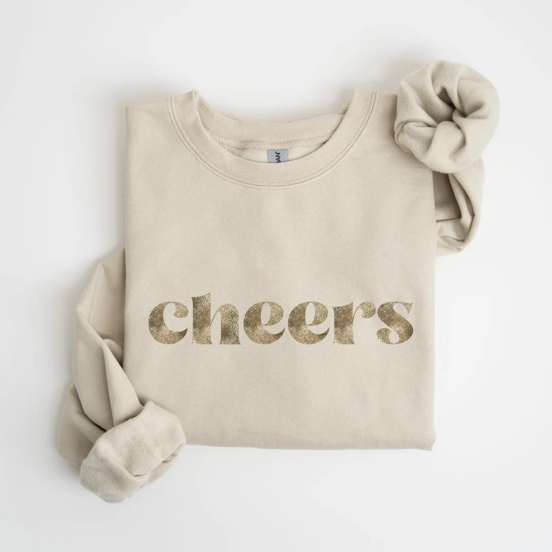 Cheers New Years Sweatshirt from Etsy. 



New Year’s Eve sweatshirt, cheers sweatshirt, sparkly glitter cheers sweatshirt, Retro Font Top, Faux Glitter Shirt, Party Outfit, 2025 Celebration, holiday style, 

#LTKHoliday #LTKFindsUnder50 #LTKSeasonal