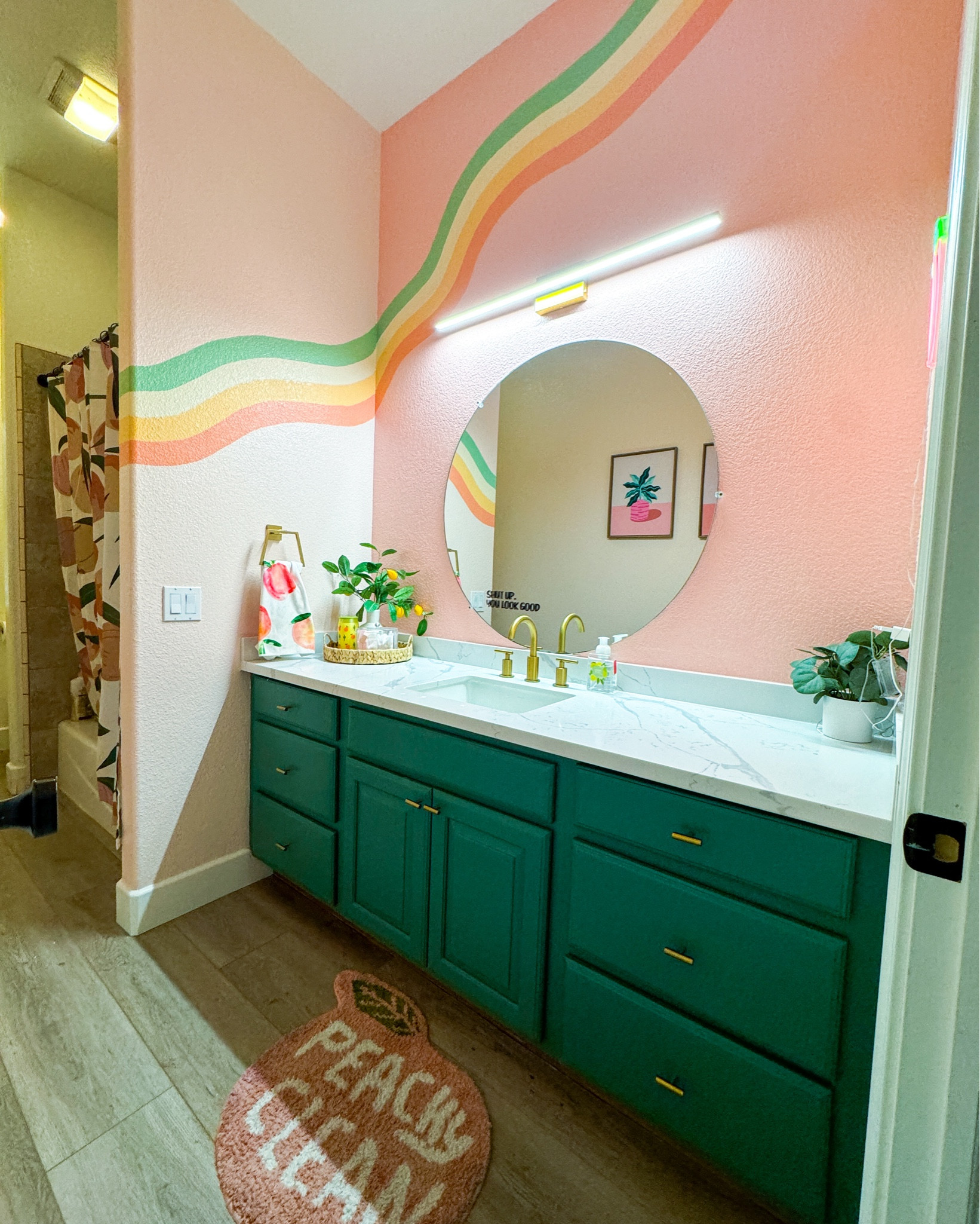 Peachy bathroom makeover | guest bathroom peach theme DIY cabinets groovy decor green/pink 🍑

#LTKFamily #LTKSaleAlert #LTKHome