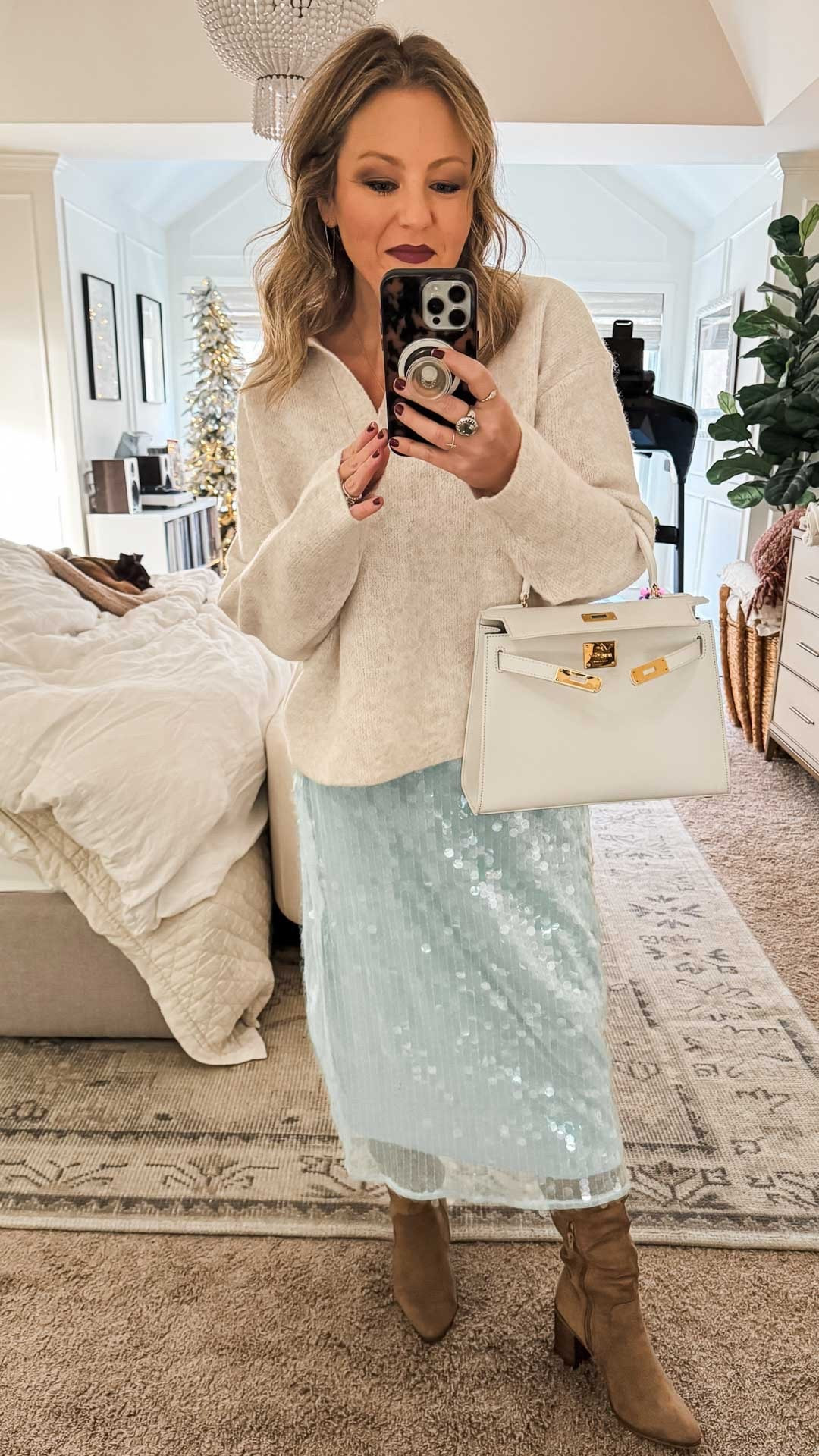 Love this wintery festive little number and everything is on sale! The sequin skirt is just $18 now (I have the gray one too) and the cream is stunning! 

#LTKSaleAlert #LTKHoliday #LTKootd