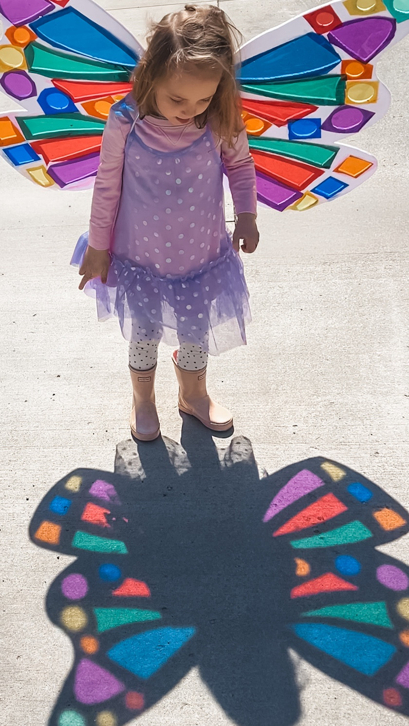 DIY butterfly wings that make sunny days feel like magic ✨ Here’s how to make this fun spring craft! 🦋🧚🏻‍♀️

How to make them:
	✨Draw a butterfly wing shape on a foam core board.
	✨(adult) Carefully cut it out with a utility knife, then trace and cut a matching wing out of the second board.
	✨Cut out “windows” inside each wing where the stained-glass colors will shine through.
	✨ Glue colorful cellophane (acetate sheets) over the openings on the back side  
	✨Overlap the centers of the wings, punch a few holes, and lace ribbon or elastic through to make them wearable.

#LTKmomlife #LTKKids