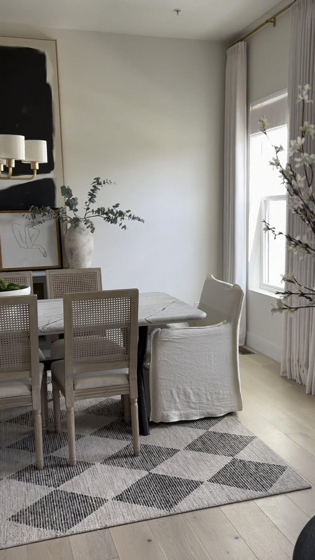 Elevated dining room: Six Penny dining chairs, Wayfair dining chairs, Crate & Barrel art, Two Pages drapes & shades, Ballard Designs hardware, Crate & Barrel marble table, Chris Loves Julia rug, Progressive Lighting chandelier, 

#LTKhome #LTKSeasonal #LTKstyletip