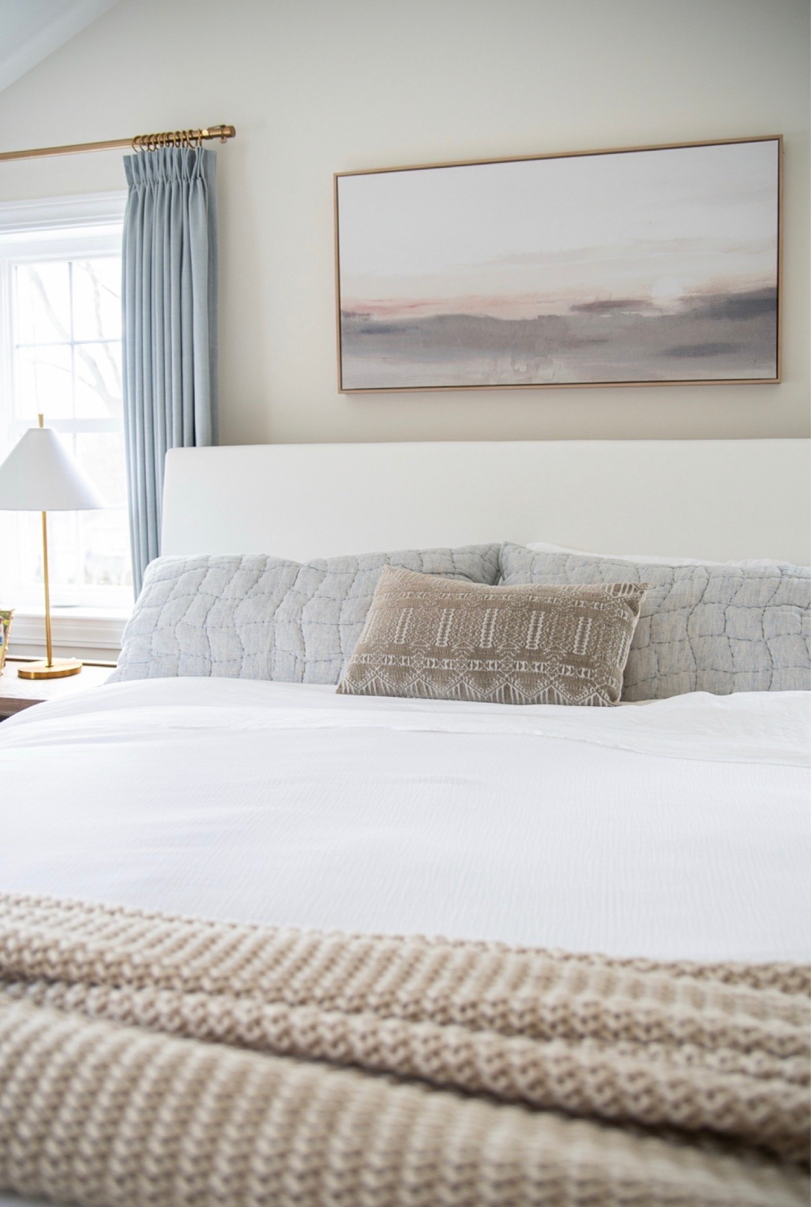 Neutral bedroom inspiration with pops of soft blue for a modern coastal look!