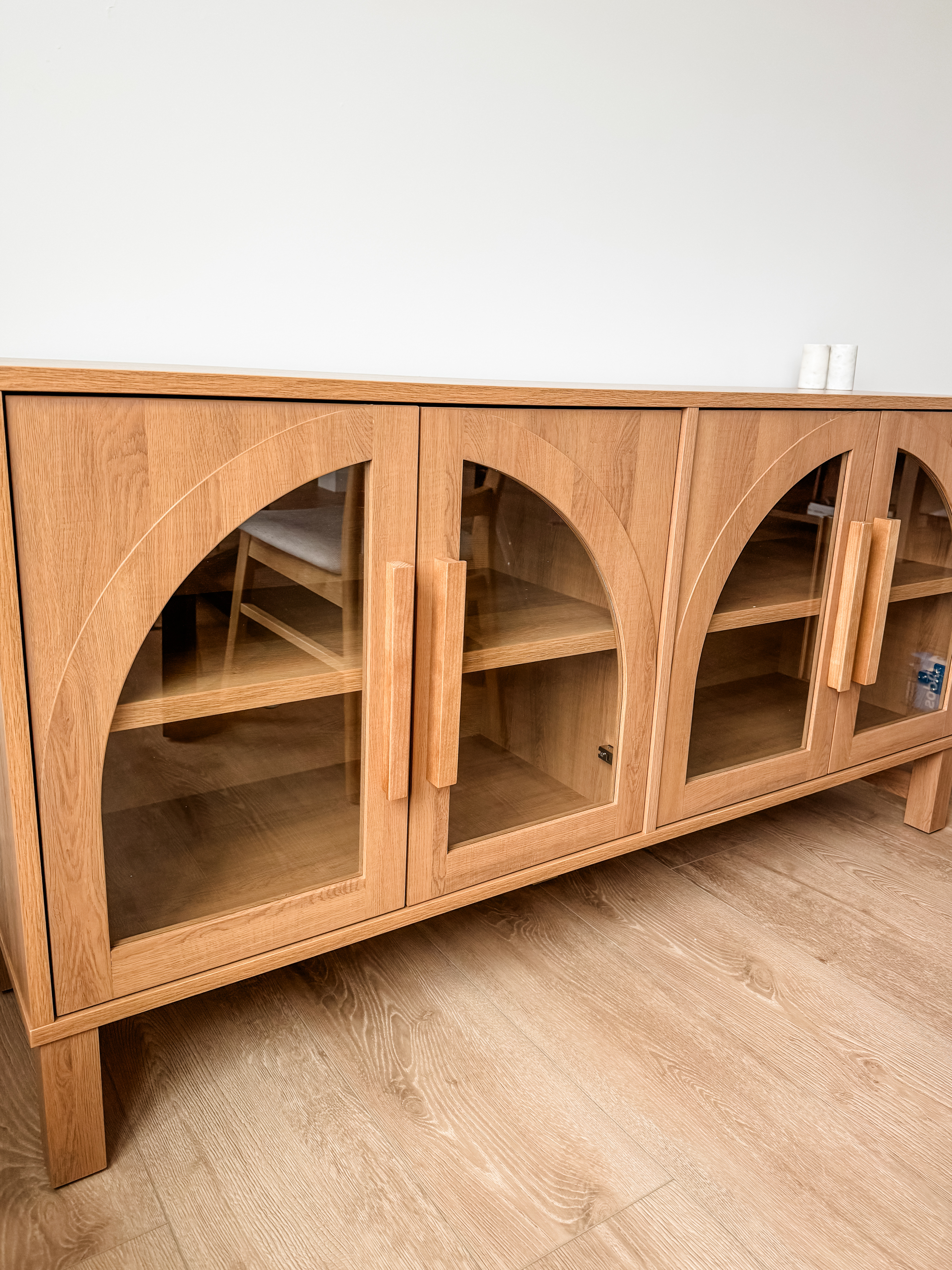 This new cabinet is giving my space the perfect blend of style and function! Its arched glass doors add a just enough in trend details while providing practical storage. I can’t wait to style it with some of my favorite decor pieces. A beautiful addition that ties the whole room together!

#LTKHome #LTKStyleTip