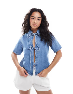 ASOS DESIGN denim tie front short sleeve top in mid blue | ASOS (Global)