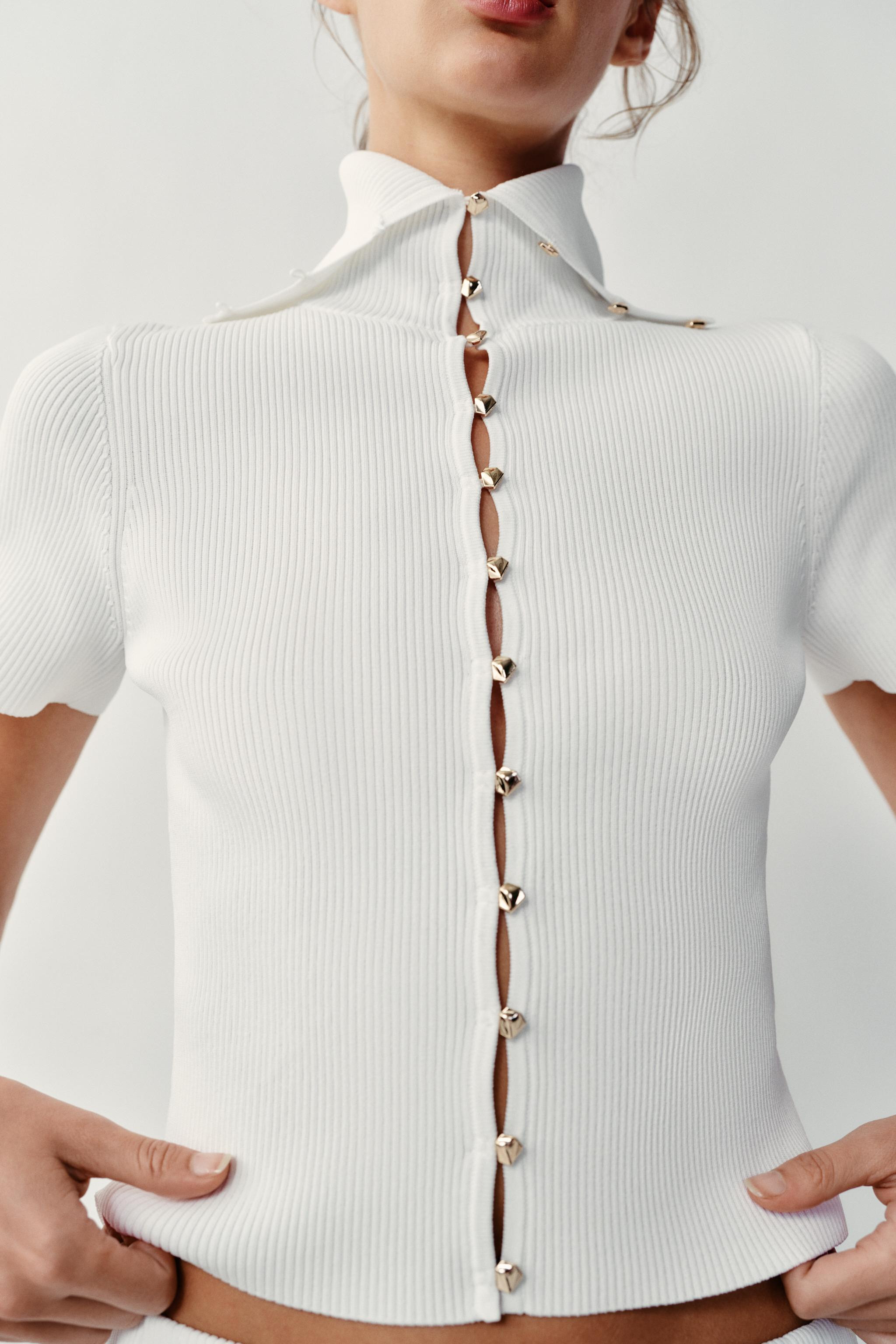 Model height: 173 cmRibbed cardigan with a regular collar and short sleeves. Front fastening with... | Zara UK