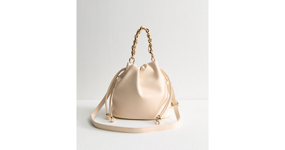 Cream Faux Leather Drawstring Crossbody Bag | New Look | New Look (UK)