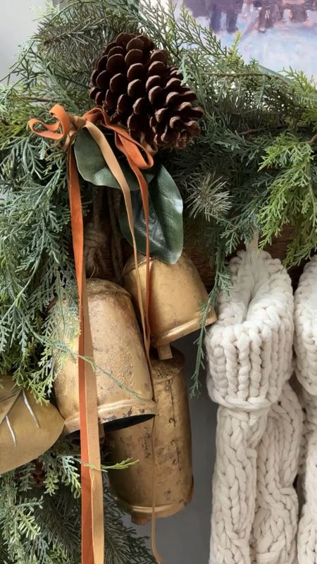 Pottery Barn holiday mantel details! I love this mixed cedar and pine garland. It’s so full and dramatic. These bells are the perfect touch, and I love how it all pairs together with the softness of the stockings! 

#LTKhome #LTKstyletip #LTKHoliday
