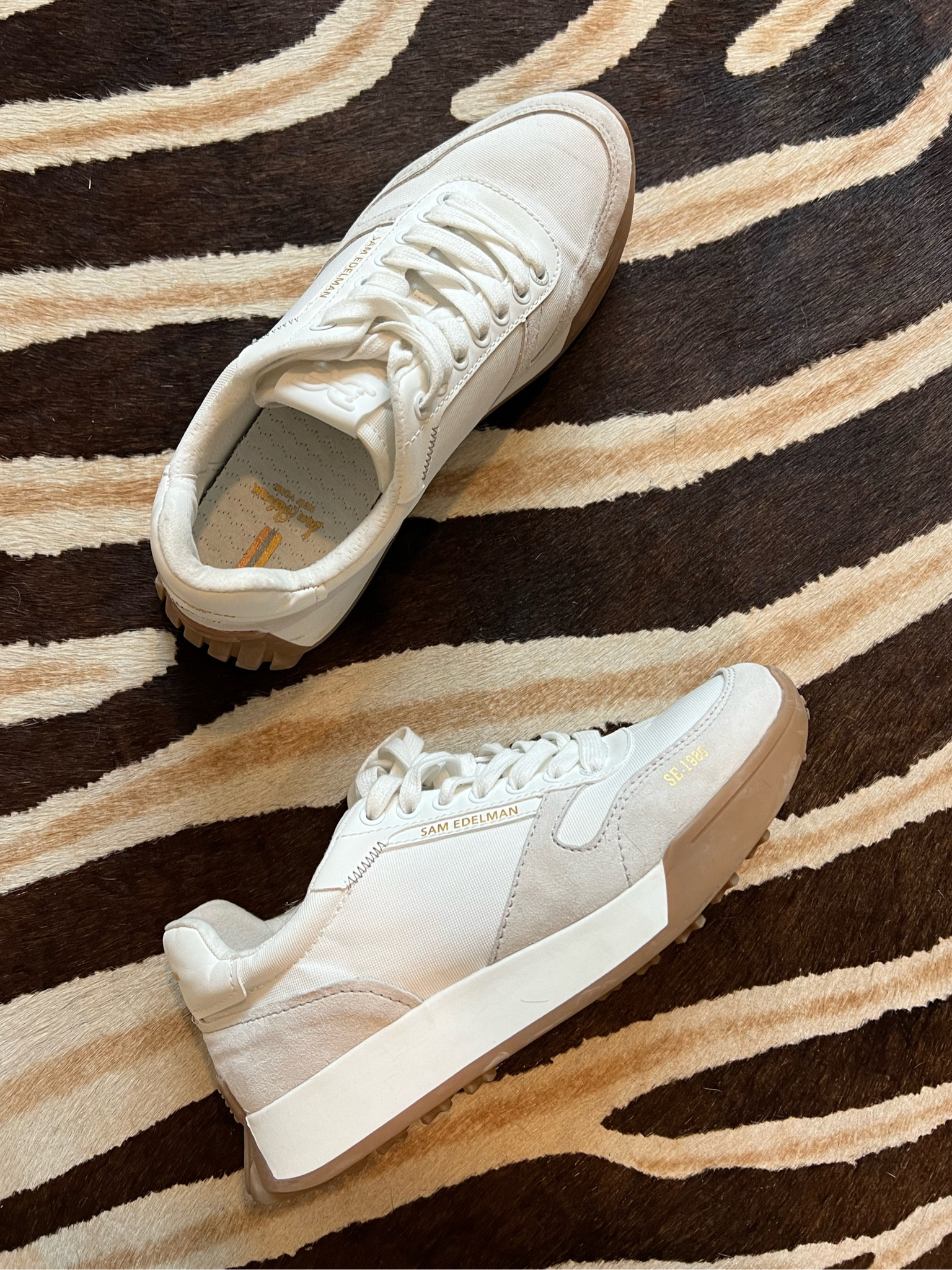 Comfort meets style with this neutral sneaker. The absolute most comfortable sneaker your closet selection needs. And it even comes in a matching kid size for twinning with your mini. 

#samedelman #sneakers #travel #neautralshoe 

#LTKStyleTip #LTKTravel #LTKFindsUnder100
