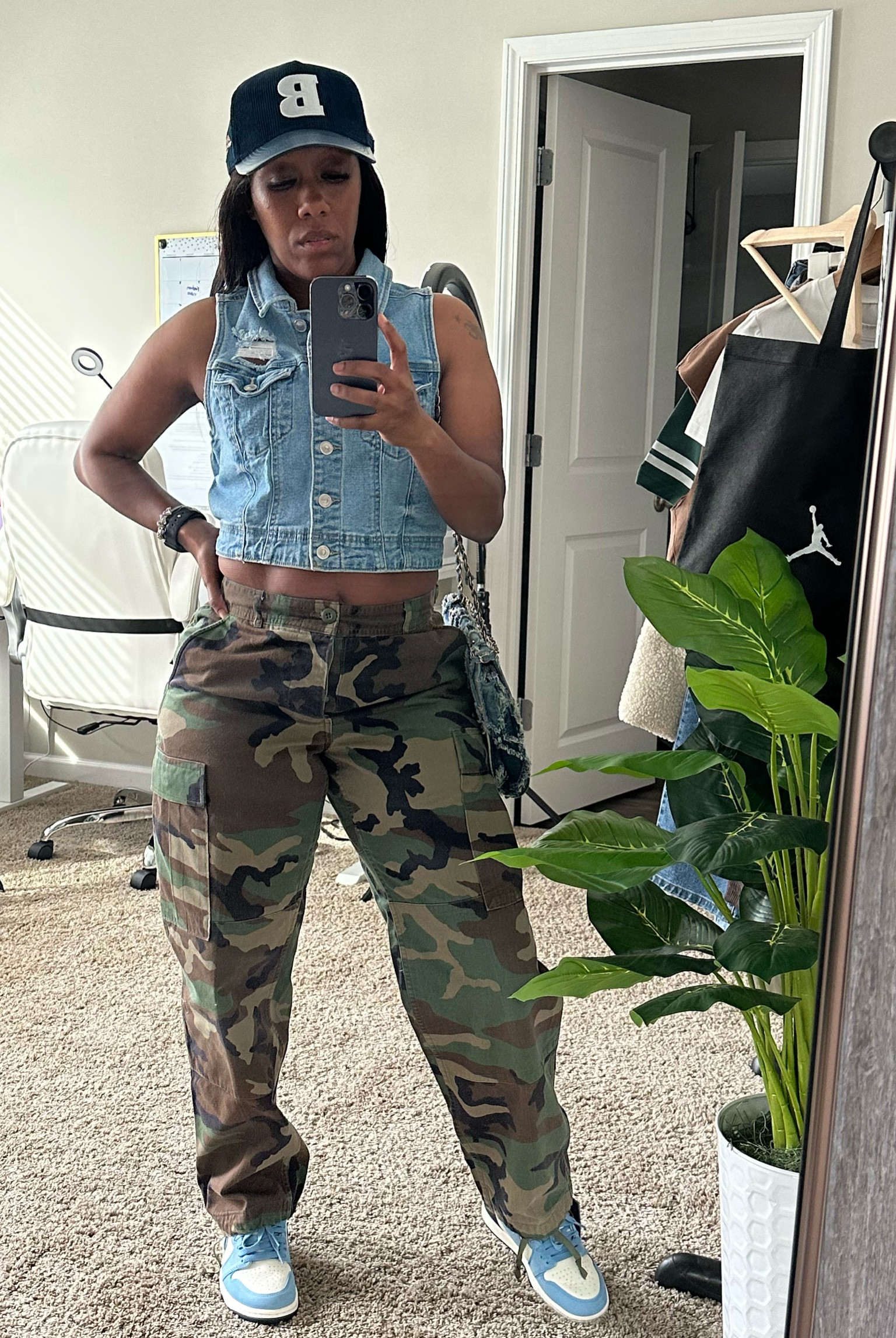 Camo pants with denim distressed vest. I styled this casual outfit with a navy hat, denim distressed crossbody bag, and Jordan 1 first in flight sneakers

#LTKPetite #LTKShoeCrush #LTKStyleTip