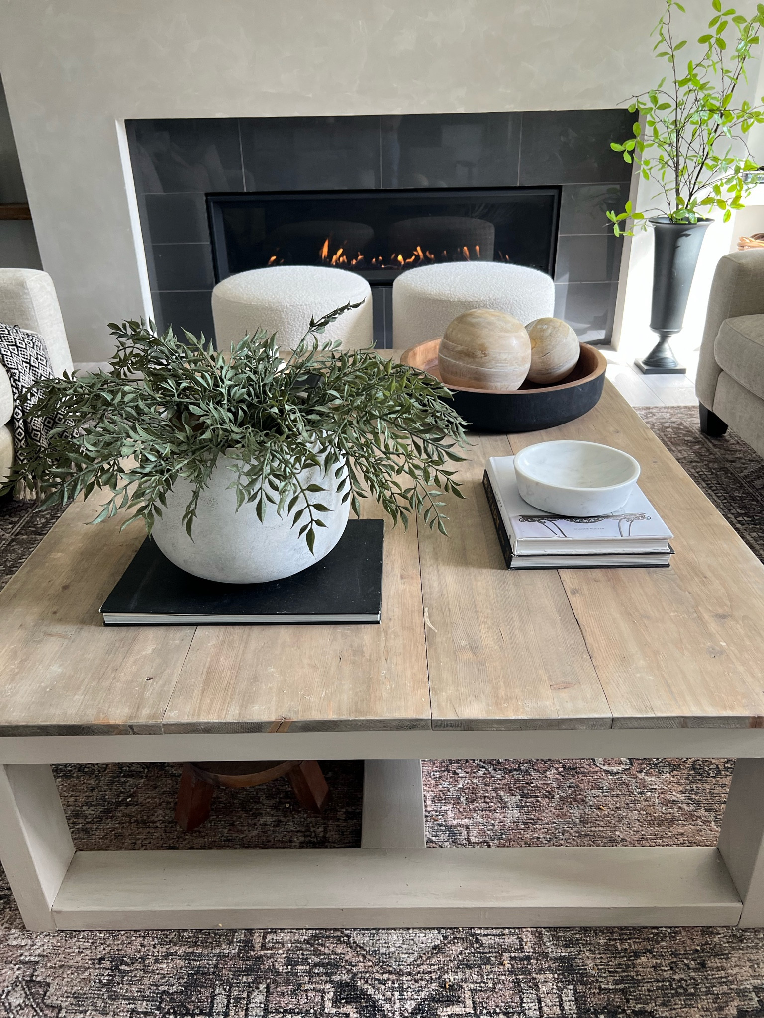My refurbished coffee table! 
I have the Cariton coffee table from Ashley furniture. I’ve replaced the top on mine..with spruce lumber, which we glued on top of the table. Stained with minwax combination of walnut/classic grey. The base of my table is painted with Fusion mineral paint in chateau. 