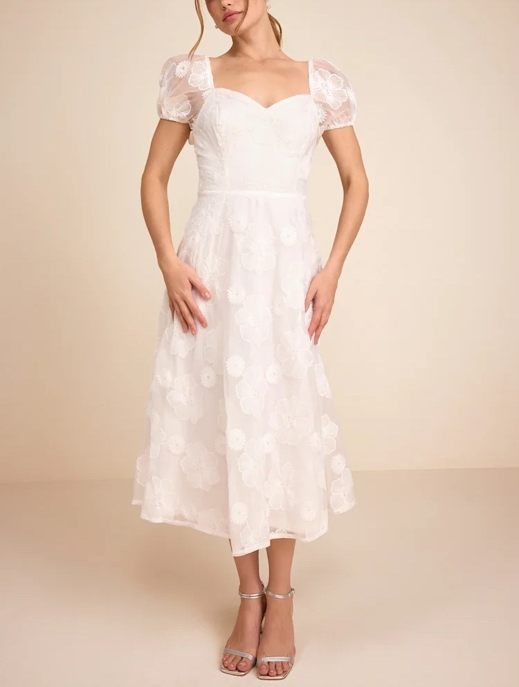 Inspired by European garden elegance, this white embroidered puff sleeve midi dress features delicate detailing and a structured silhouette. The puff sleeves add soft volume, creating a refined and romantic presence suited for elevated daytime occasions. Under $80.

Keywords:

* white midi dress
* embroidered midi dress
* puff sleeve dress
* wedding guest dress
* bridal shower dress
* engagement party dress
* summer occasion dress
* feminine midi dress
* romantic white dress
* elegant white dress
* garden party dress
* brunch outfit dress
* resort wear dress
* statement midi dress

#LTKgrwm #LTKootd #LTKWedding