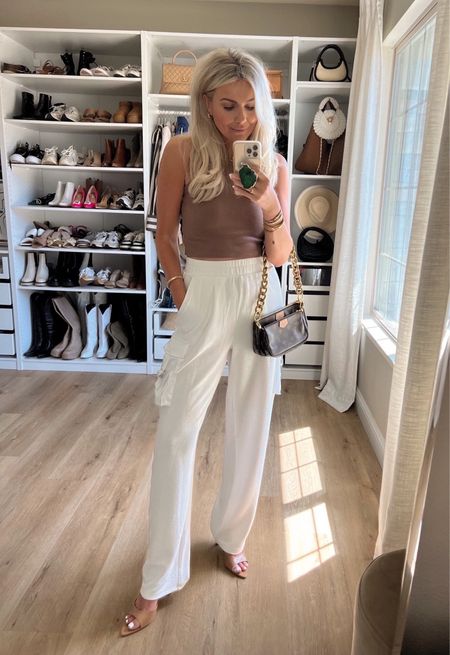 Spring fashion trend 
White high rise cargo pants that can double as a swim swimwear cover up - true to size, wearing M
Amazon cropped tank - sized up to M 
Comfy trendy heels true to size 
Amazon gold handbag strap 



#LTKworkwear #LTKunder50 #LTKstyletip