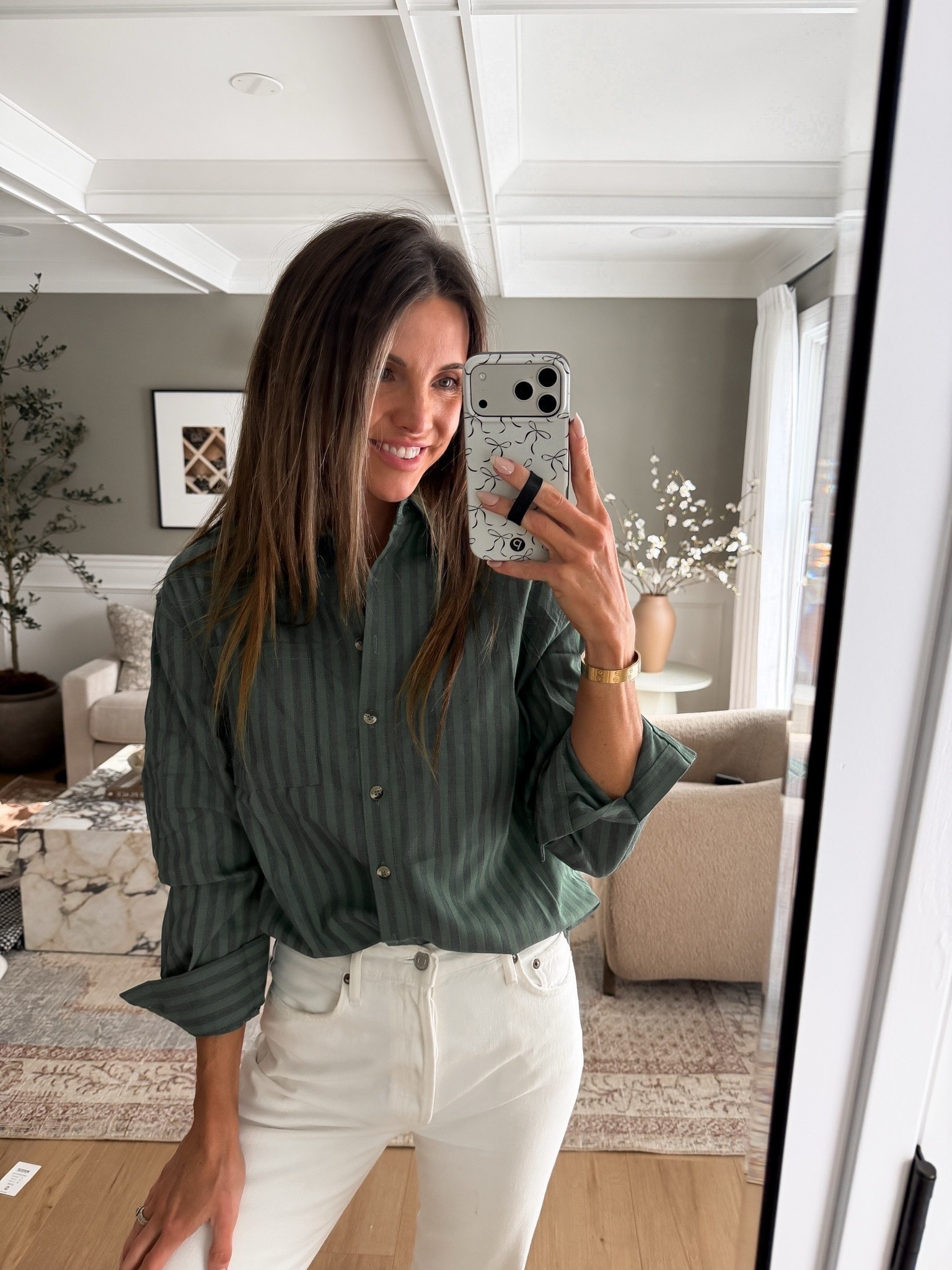 This striped button down is so good! I love the slightly oversized fit of it, and this dark blue/green is beautiful. Style it for the office or wear it with jeans this fall. I did my normal size!

#LTKgrwm #LTKootd
