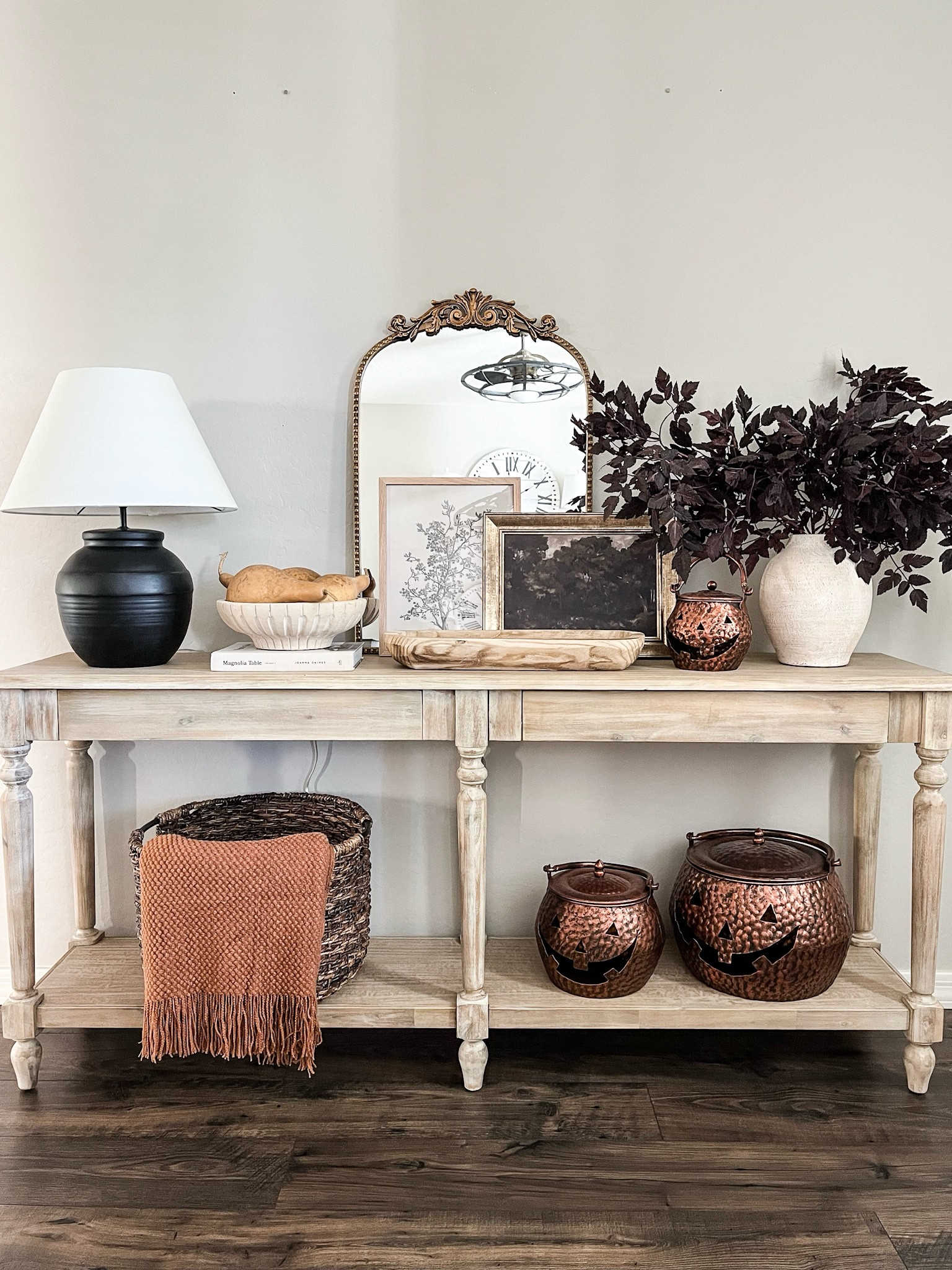 Fall console table styling!  For reference 6 stems are used here. These are a cheaper version of the more expensive brand and they come out about $10 a stem!

Wood Console table | gold mirror | moody prints | copper pumpkins | fall throw blanket | table lamp | dough bowl | vase | decorative bowl | cimicifuga stems 

#LTKStyleTip #LTKSeasonal #LTKHome