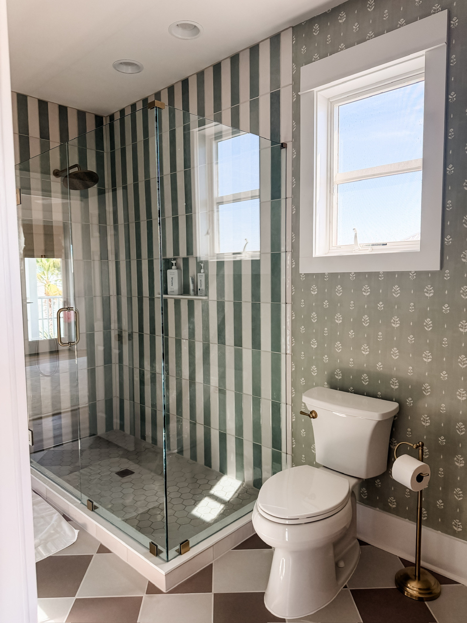 If you know me, you know I love to mix prints! I am so happy with how our bathroom turned out at our beach house! The tiles and wallpaper aren't linkable, so writing here where they are from! The wallpaper is called "wildflower print wallpaper" from Love vs Design. The floor tiles, including the ones in the shower are both from Floors & Decor. The checkered tiles are called Luxe Sand Matte Porcelain Tile and Luxe Fog Matt Porcelain Tile. The shower floor is called Luxe Sand Hexagon Matte Porcelain Mosaic. The tiles on the shower wall are from msisurfaces.com, and the colors are Renzo Jade ceramic tile (3x12) and Renzo Dove ceramic tile (3x12).

Loverly Grey, home finds, home inspo, bathroom inspo, beach house 

 #LTKHome