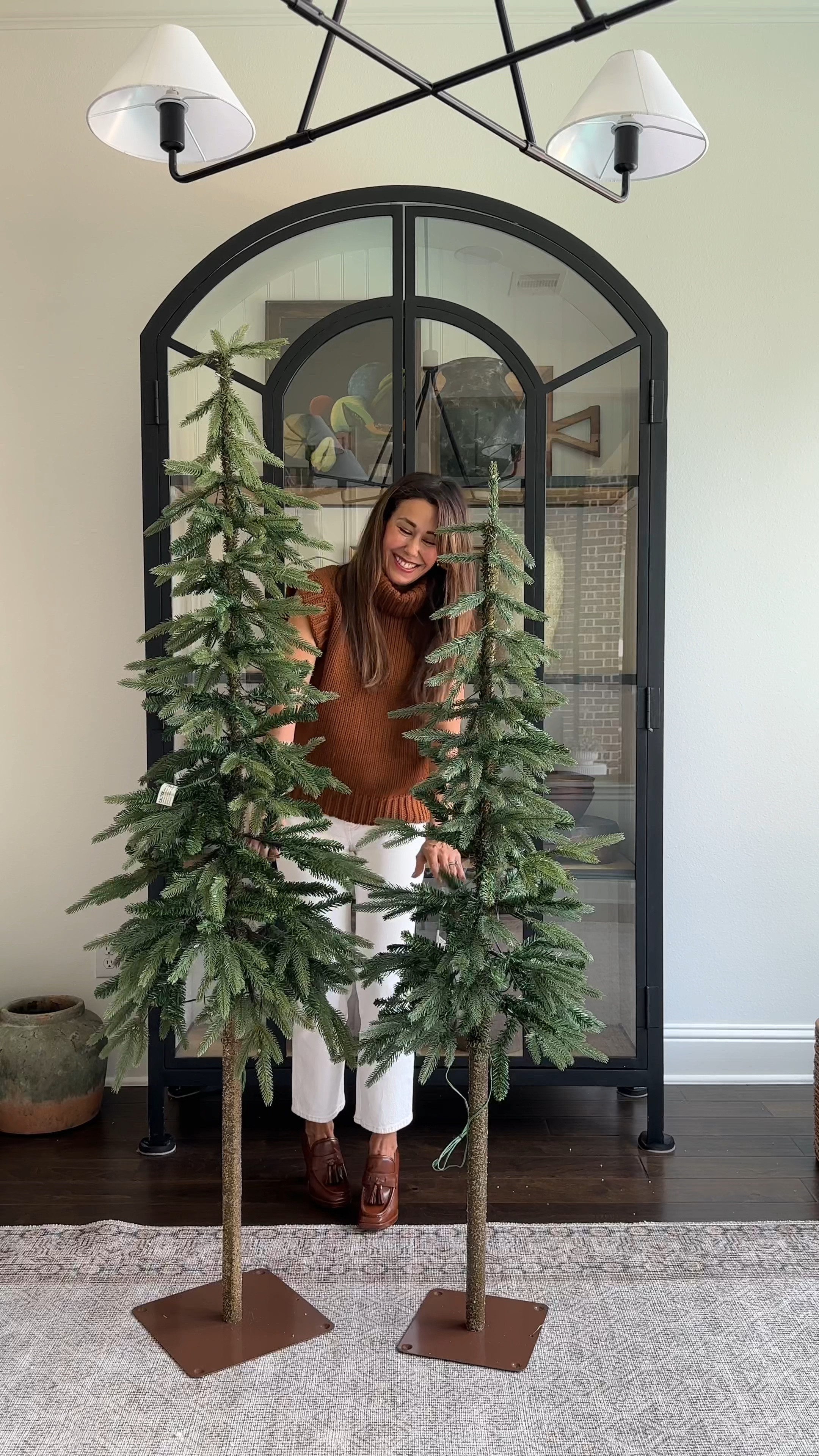 👉👉 I linked similar ones from Wayfair! These faux Alpine trees (I have the 6- and 5-foot) are the perfect way to add a festive touch to any corner. I’ve linked everything here. 

My arched cabinet is discontinued so I’ve linked an alternative. 

#LTKVideo 

#LTKHome #LTKFindsUnder100